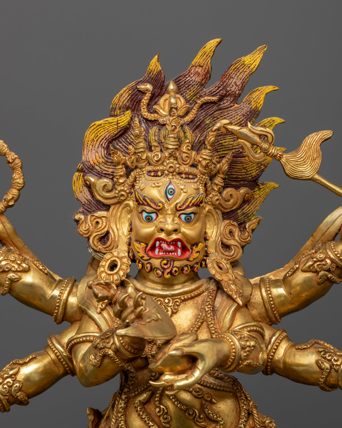 White Six Armed Mahakala Statue in gold fire gilded copper with 24K gold painted face.