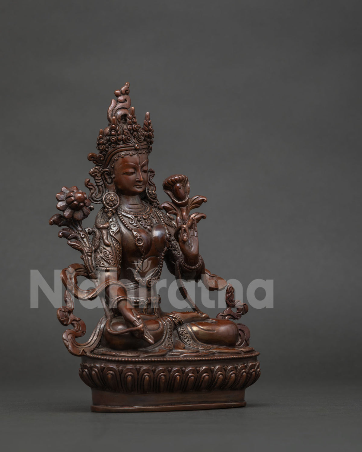 White tara seated on hand carved lotus pedestal with serene expression and elegant details.