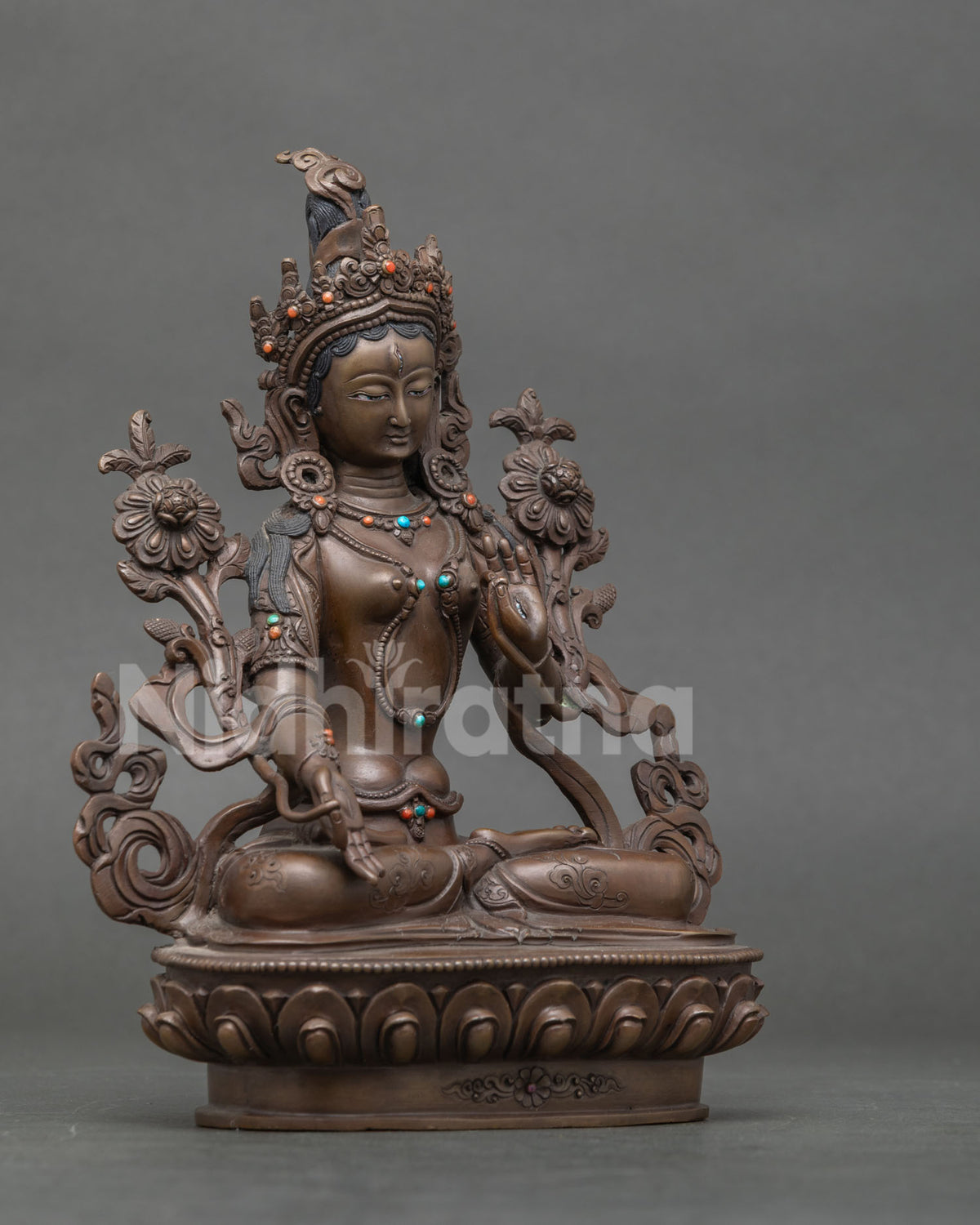 White Tara seven eyed statue on handcarved lotus pedestal.