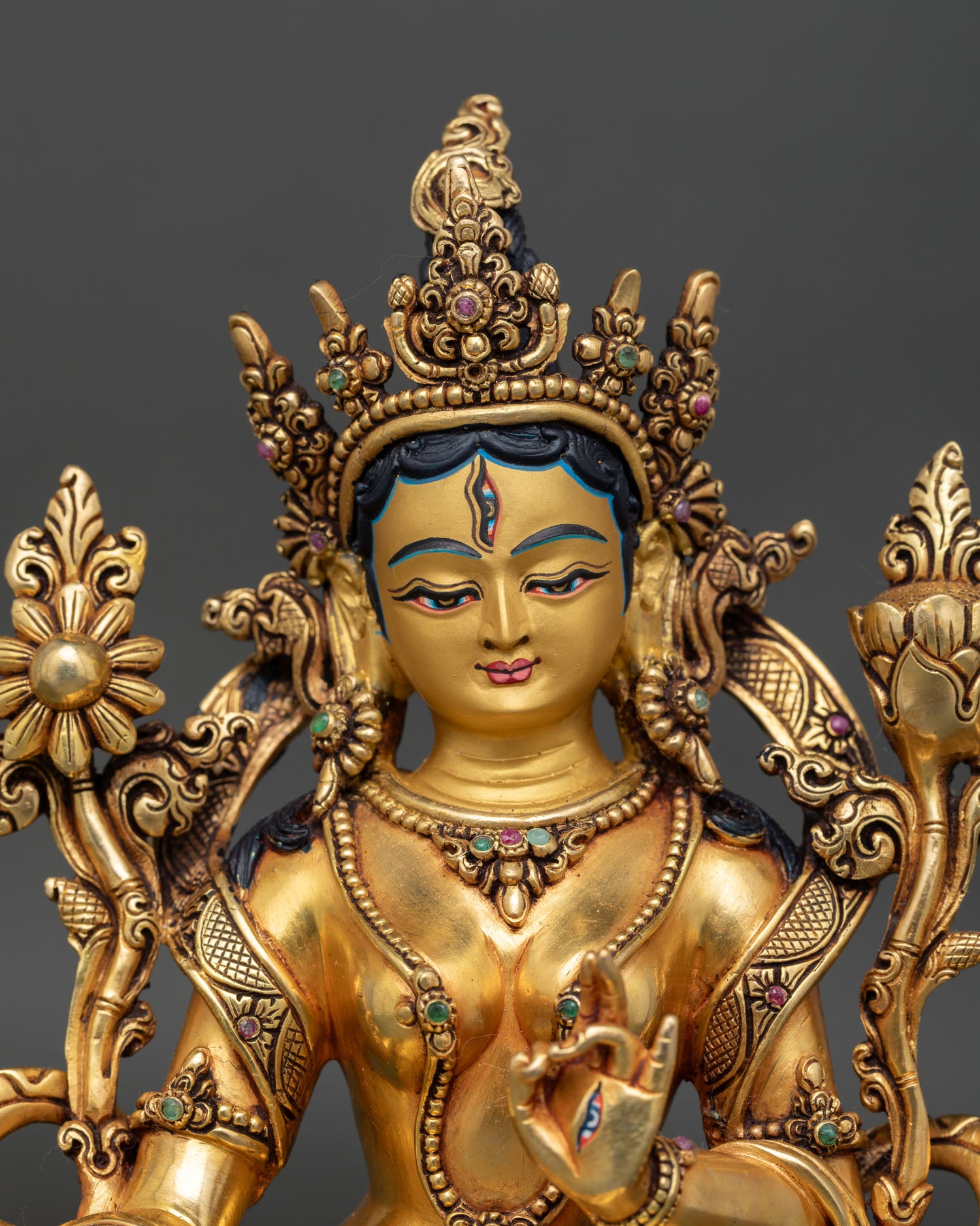 White Tara statue close-up gold detailing semi-precious stones Nepal craftsmanship