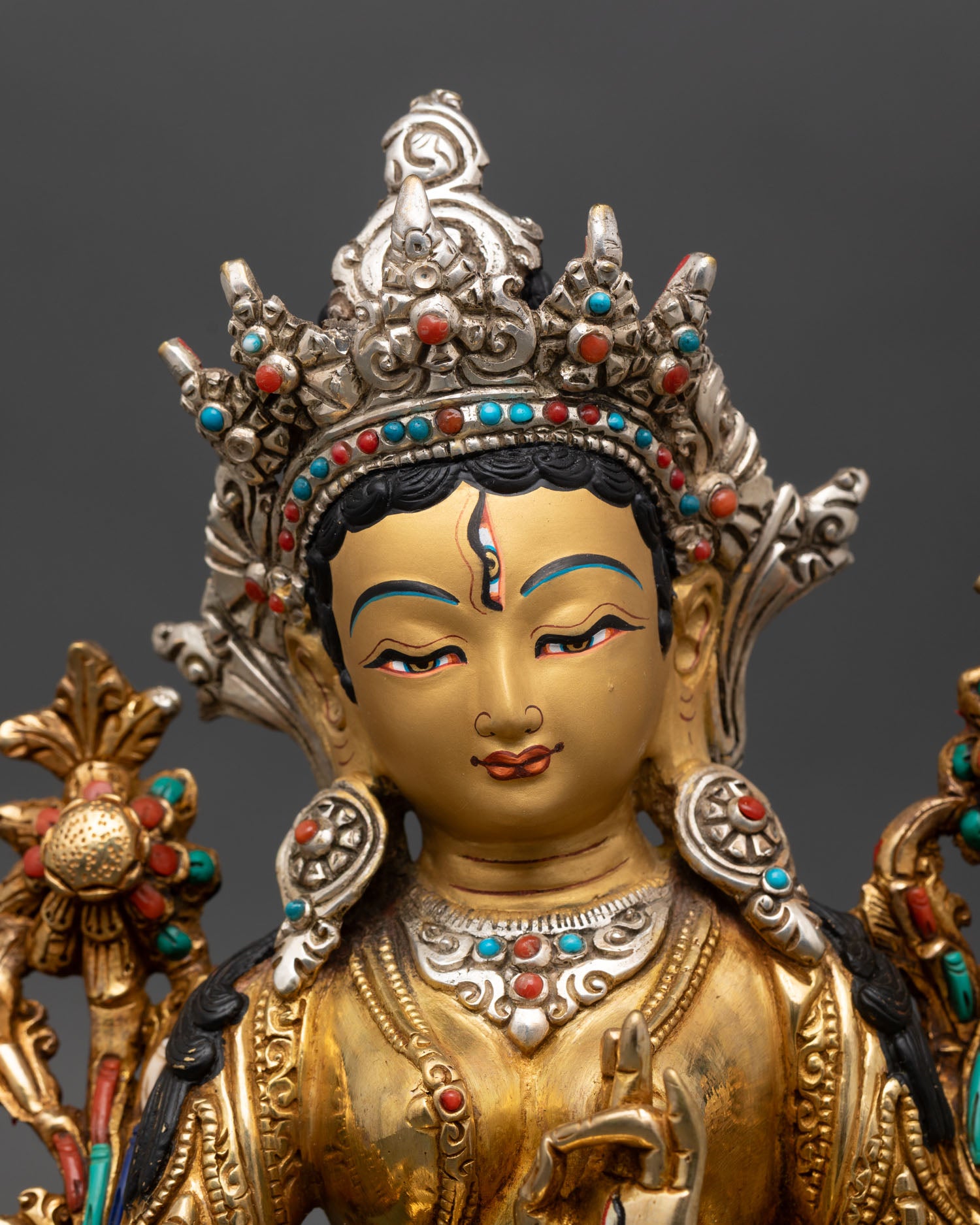 white tara statue close up, handcrafted lost wax copper with gold gilding detail