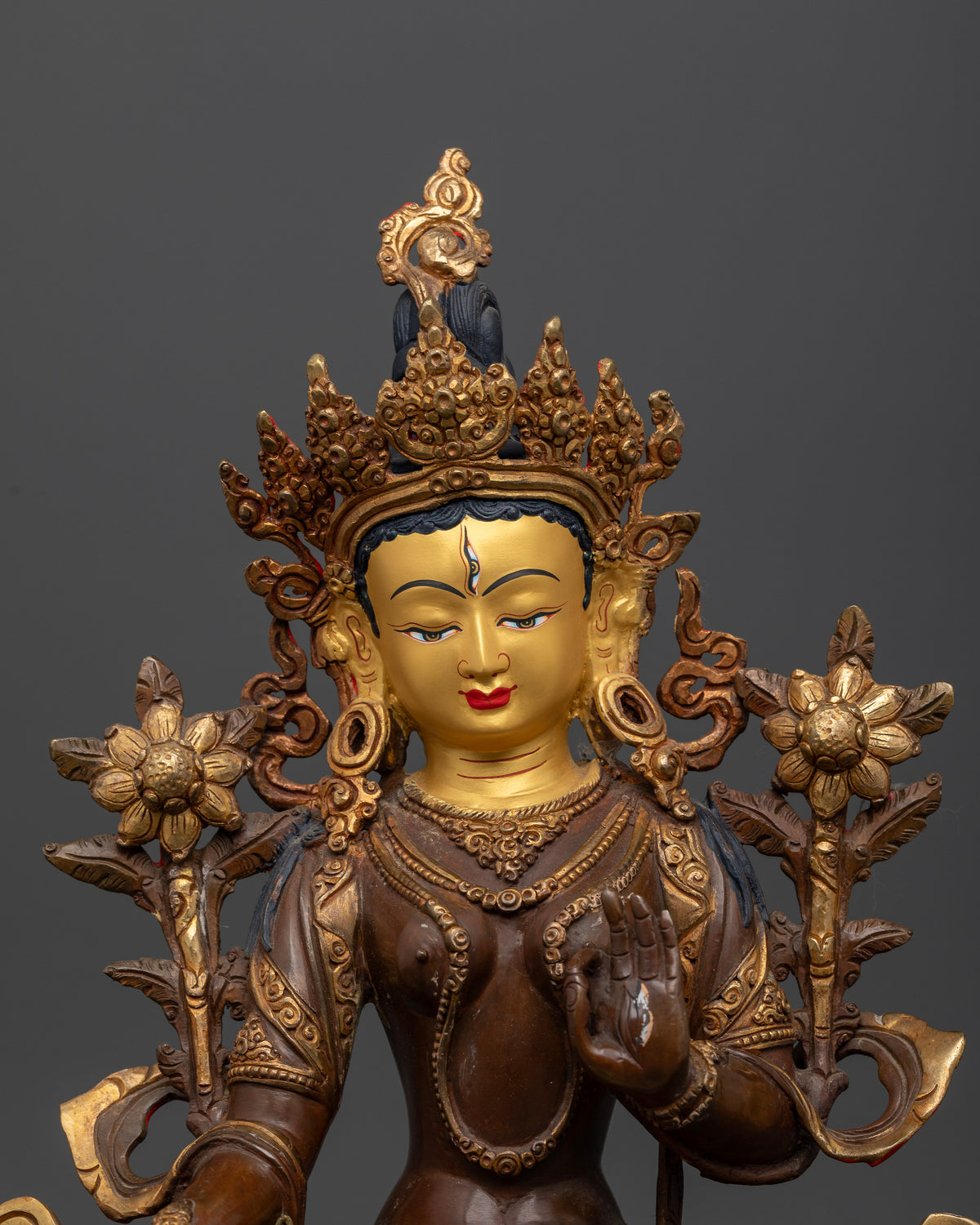 White Tara Statue handcrafted from copper with half oxidized and gold fire gilded finish and 24K gold painted face.