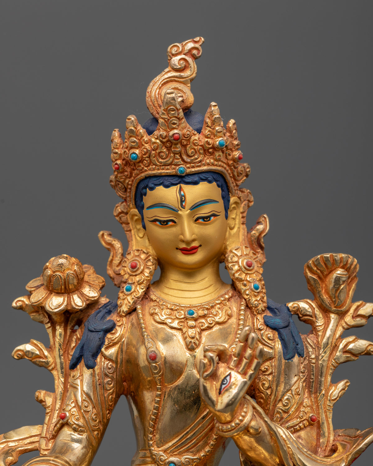 White Tara statue with 24K gold painted face.