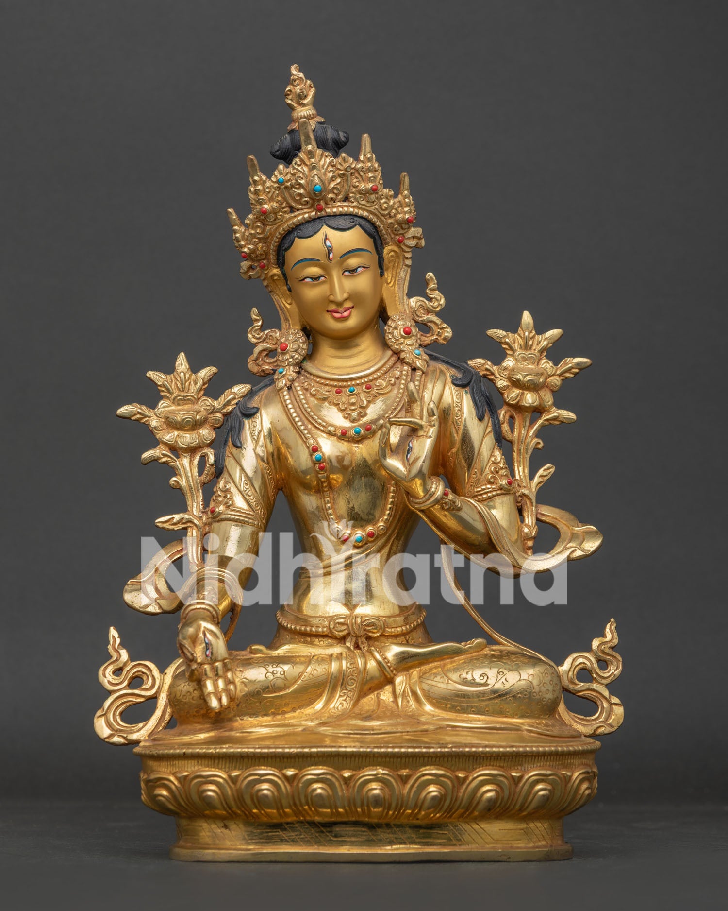 White Tara Statue handcrafted in Nepal with gold fire gilded finish and lotus pedestal.