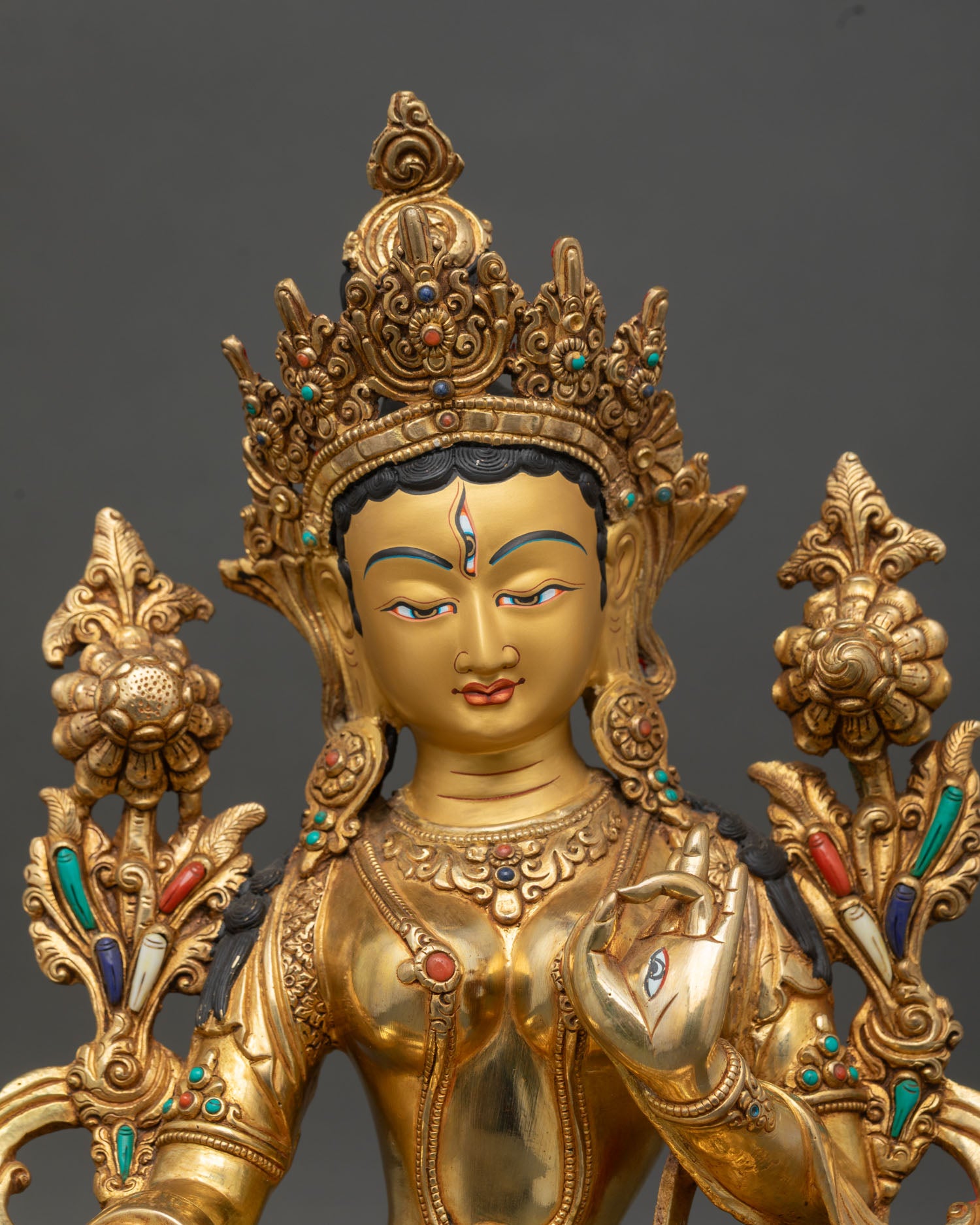 white tara statue regular close-up, intricate details of copper and gold gilding for meditation altar