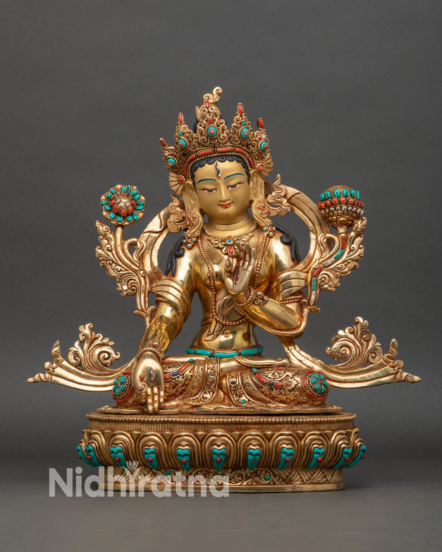 White Tara statue seated on lotus, fire-gilded gold and copper front view