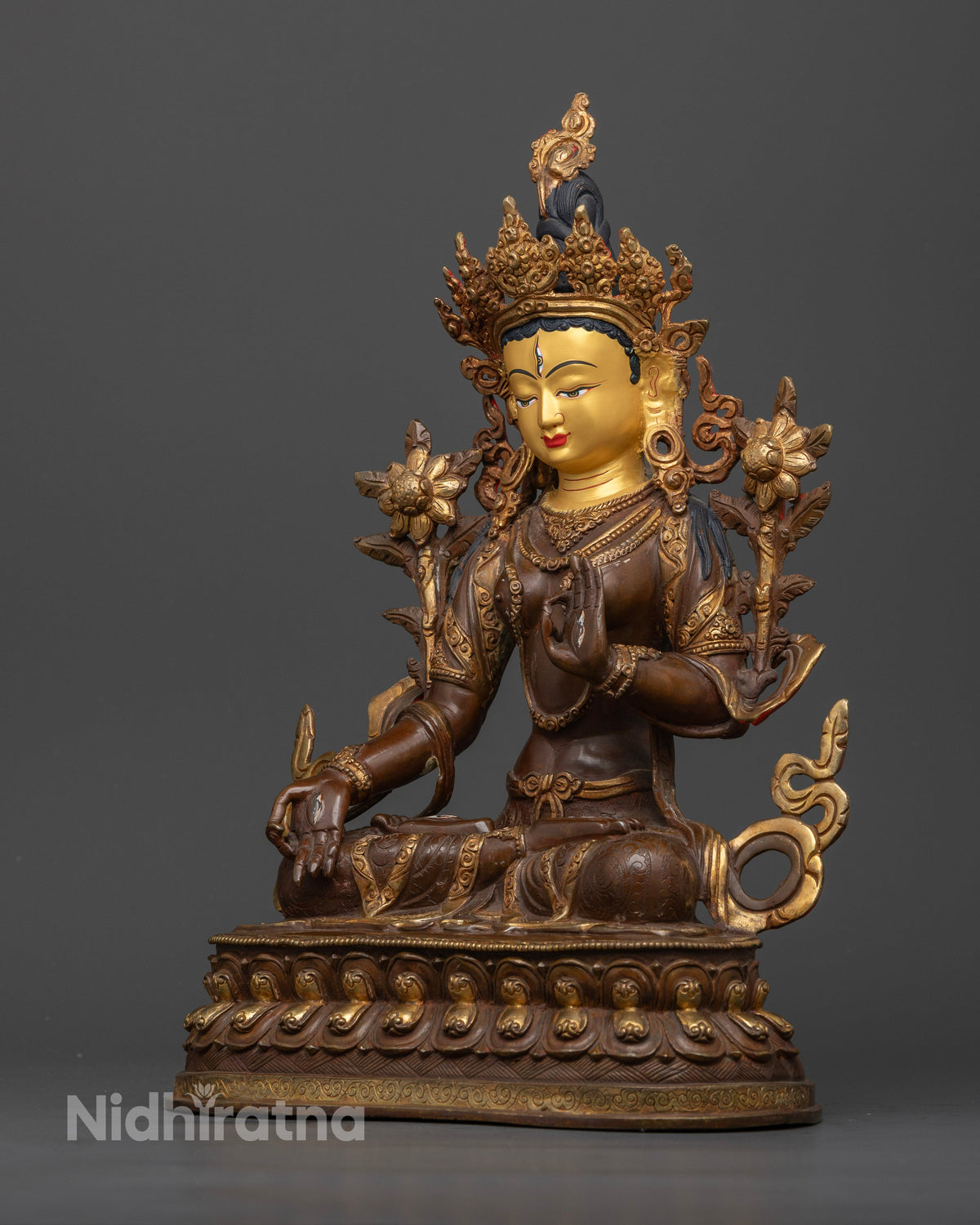 White Tara copper Buddhist sculpture showing seven eyes on her face palms and soles symbolizing wisdom and compassion.