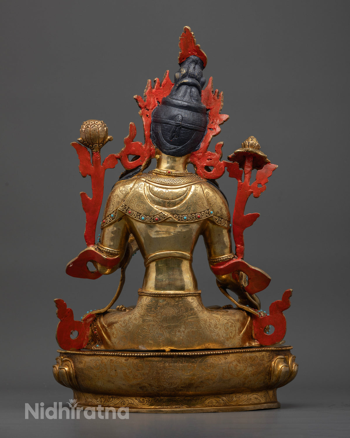 White Tara statue showing hand-chased robes and ornaments