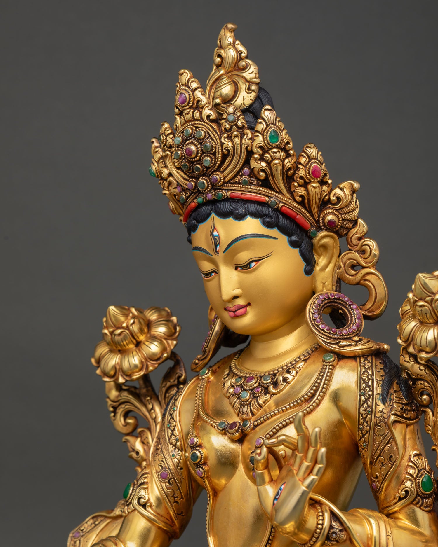 white tara statue side close up detailed crown jewelry and lotus ornaments himalayan craftsmanship