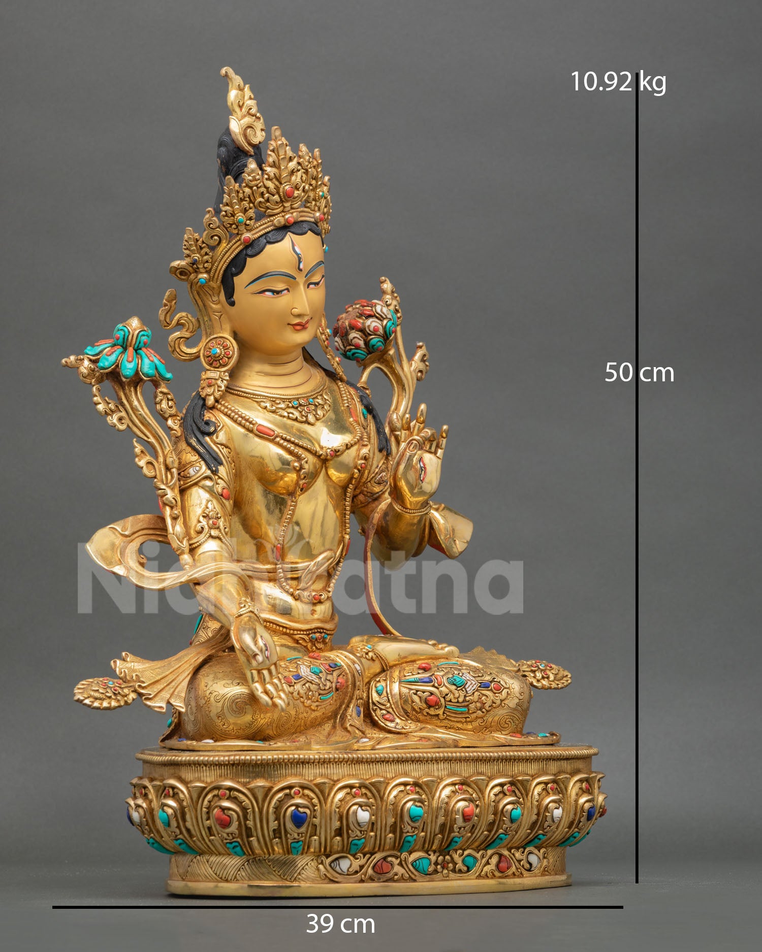 White Tara statue side view intricate copper craftsmanship gold plated accents traditional Tibetan Buddhist art longevity healing symbolism statue