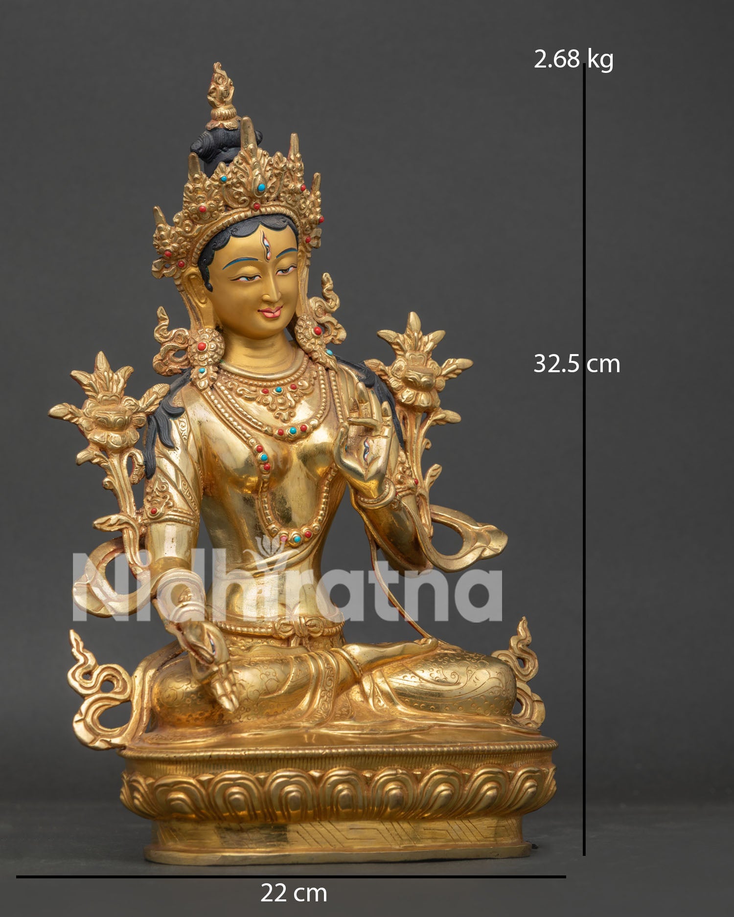 White Tara Statue with gold painted face and seven compassionate eyes.