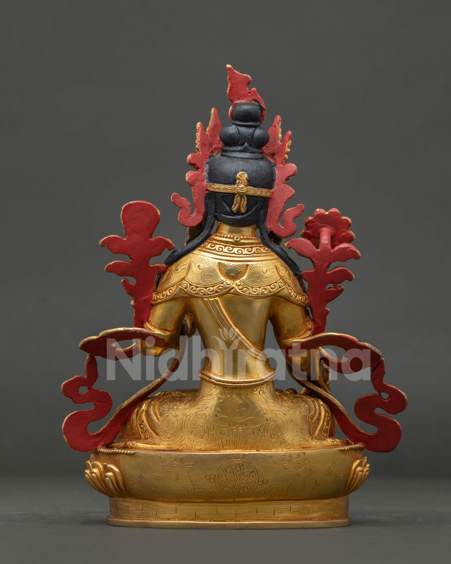 White Tara statue with handcarved Dharma Chakra deer and floral motifs.