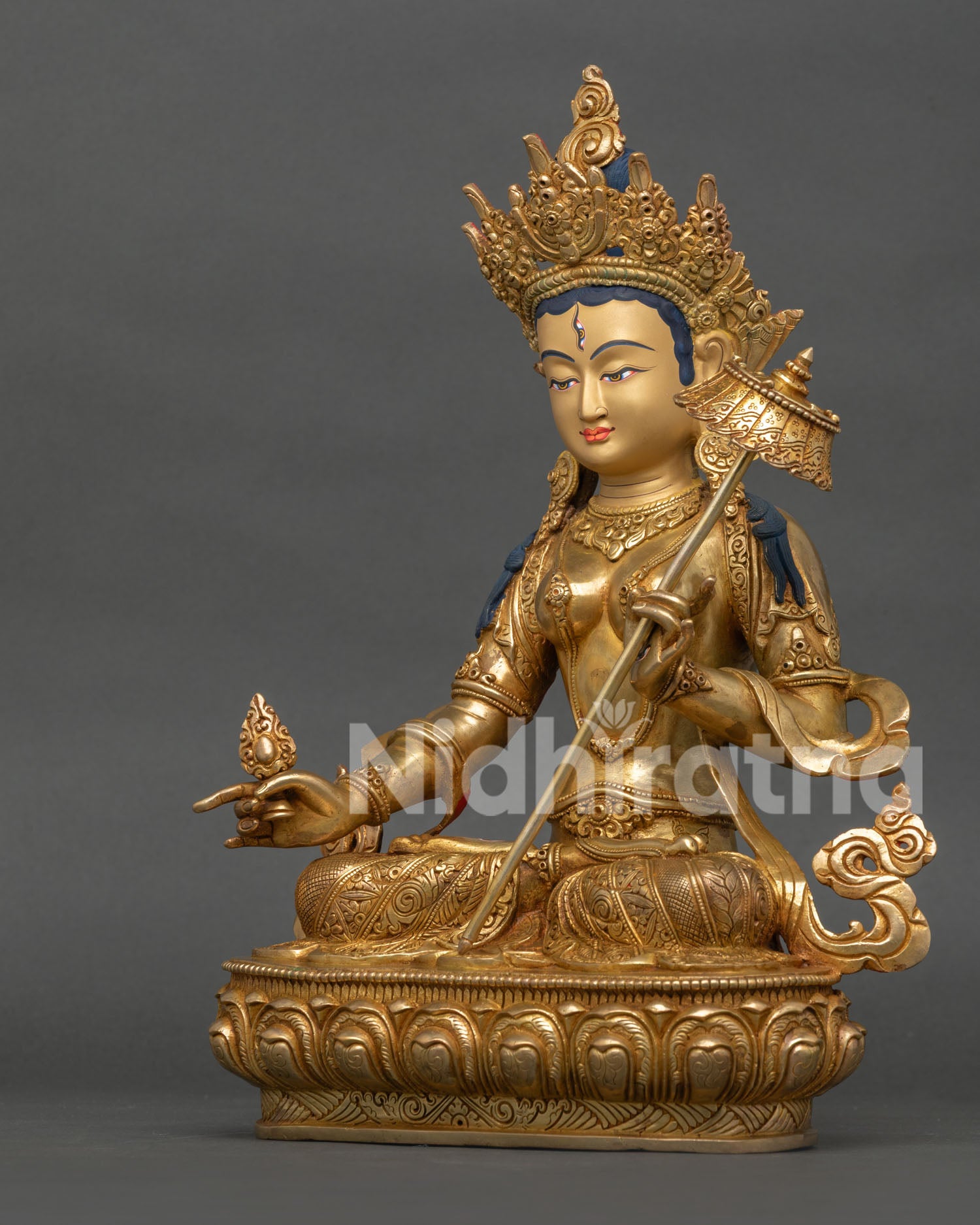 white umbrella goddess statue seated on lotus throne, vajrayana buddhist art