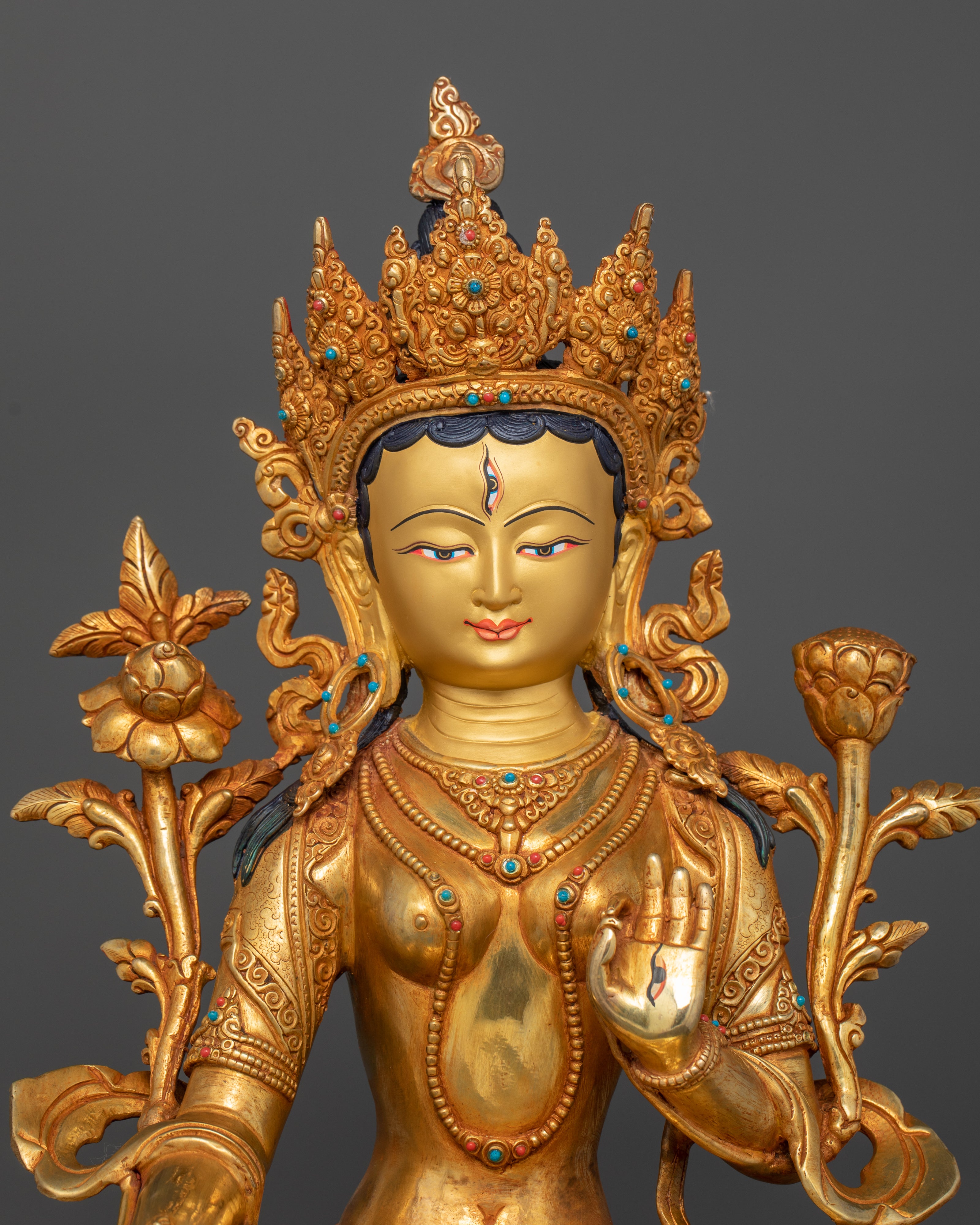 pure gold coated face of white tara gold statue