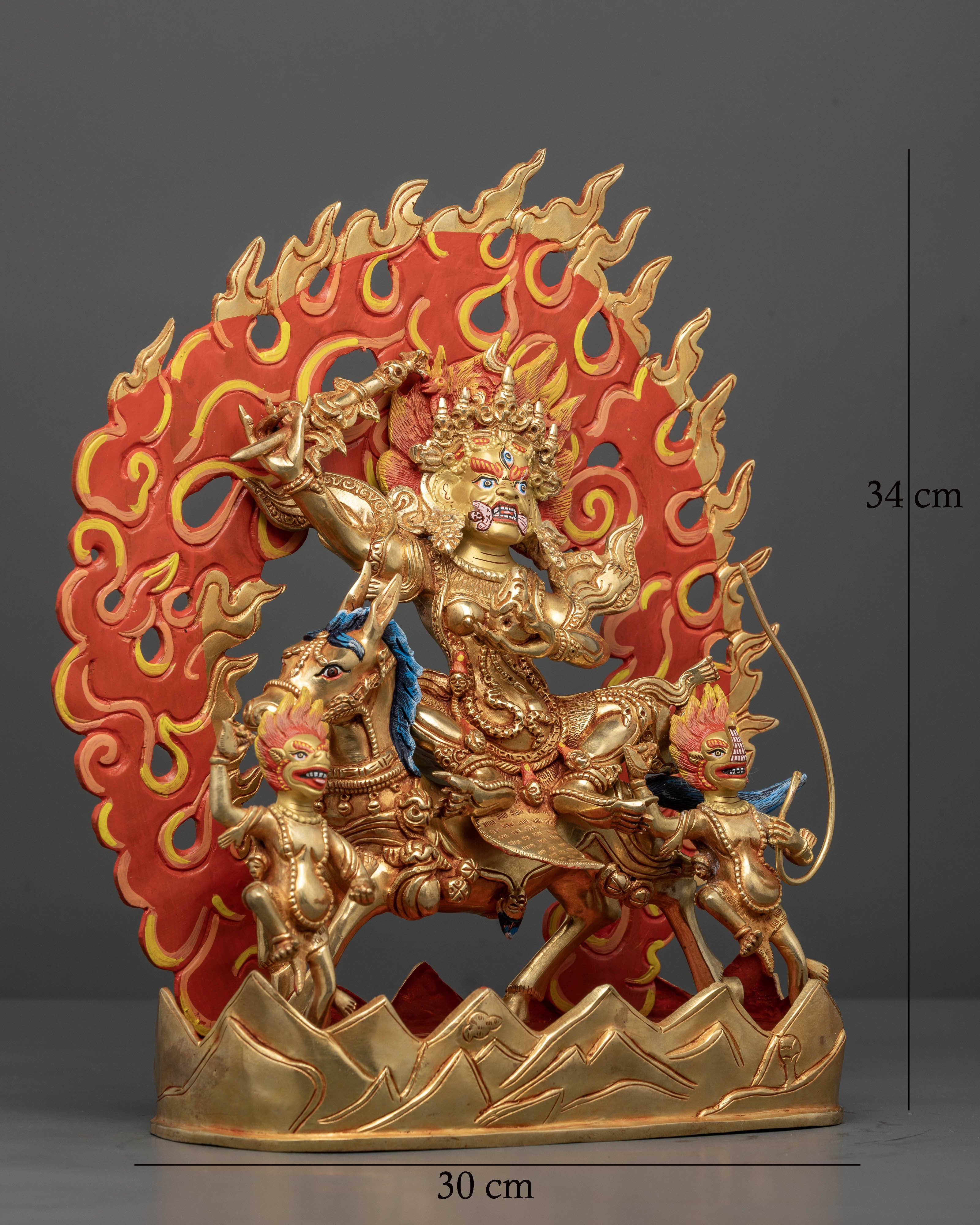 Wrathful Palden Lhamo sculpture with two disciples crossing a symbolic mountain path
