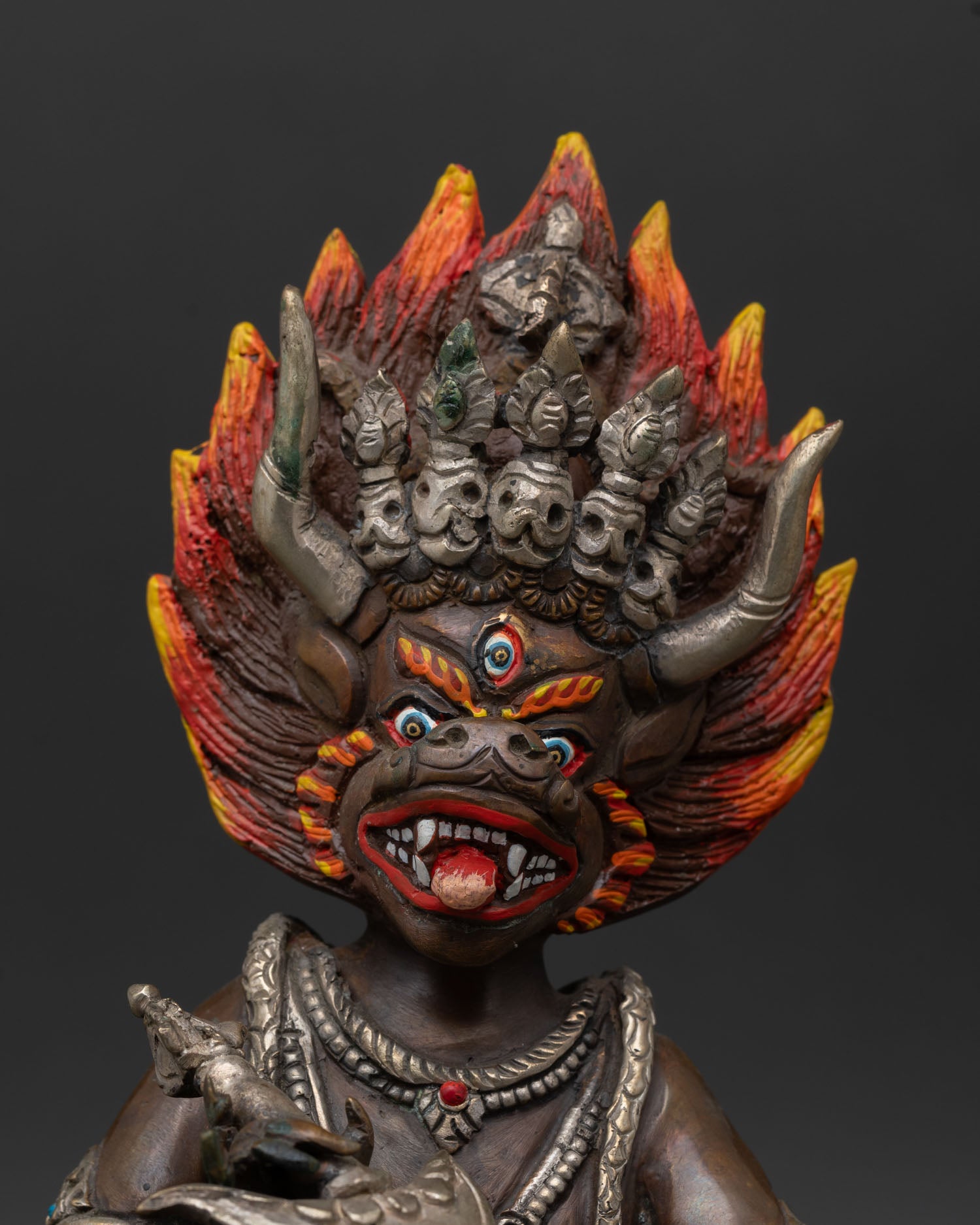 Yamantaka statue, close-up detail, fierce expression, ritual object, Vajrabhairava, Tibetan Buddhist art