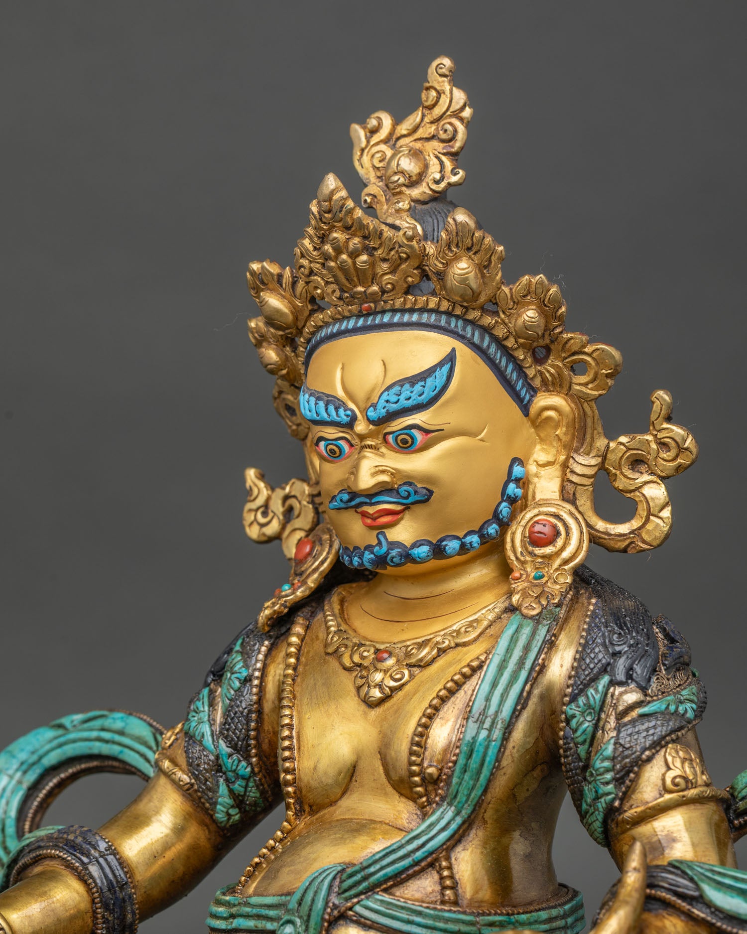 Yellow Dzambhala Statue detailed side close up showing robes and lotus pedestal carving