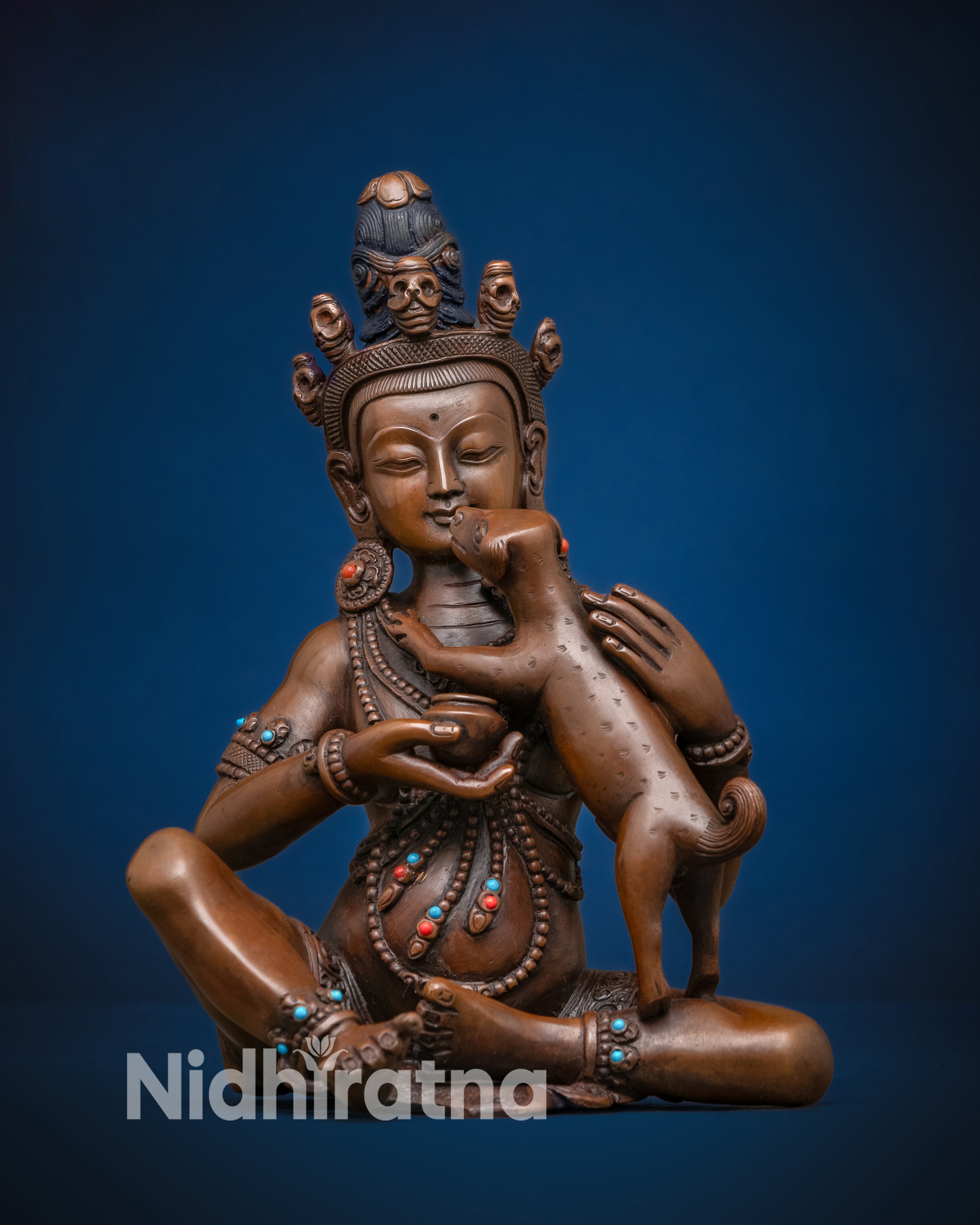 Kukkuripa Mahasiddha meditating with dogs, Vajrayana Buddhist saint who attained enlightenment through compassion.