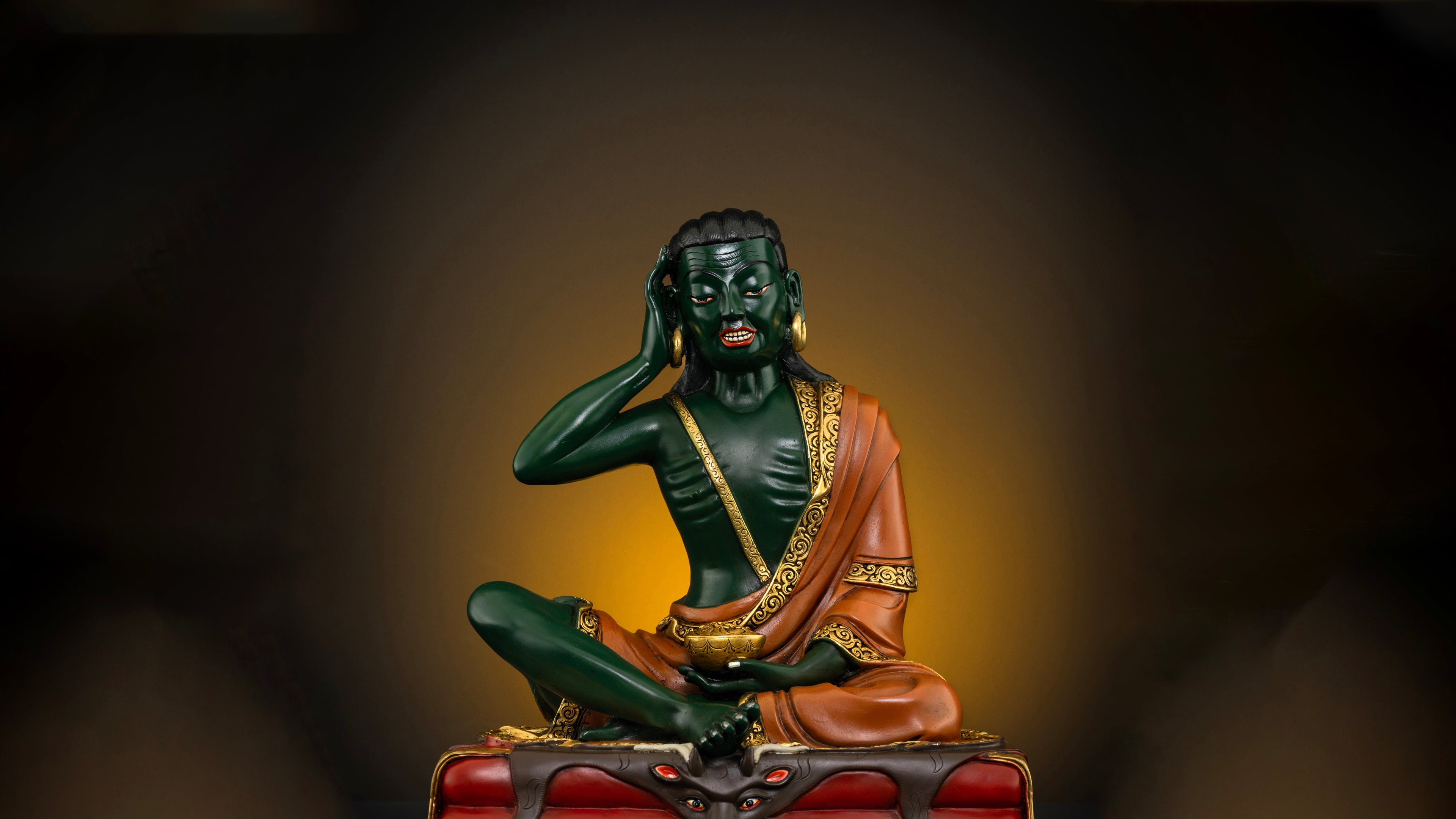 One of a kind statue of Milarepa with green skin and orange colored robes