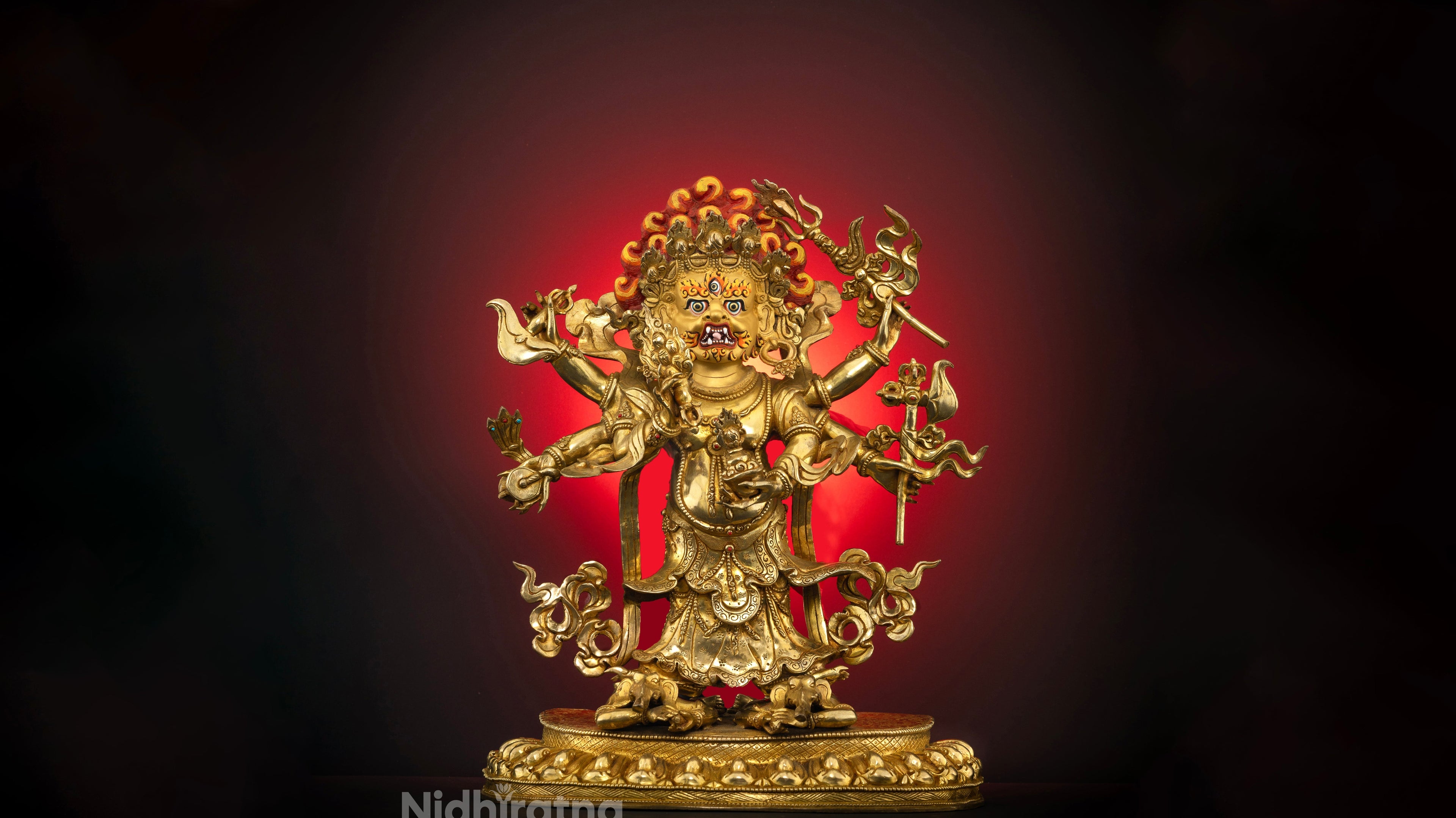 gold plated statue of white mahakala standing on a lotus seat