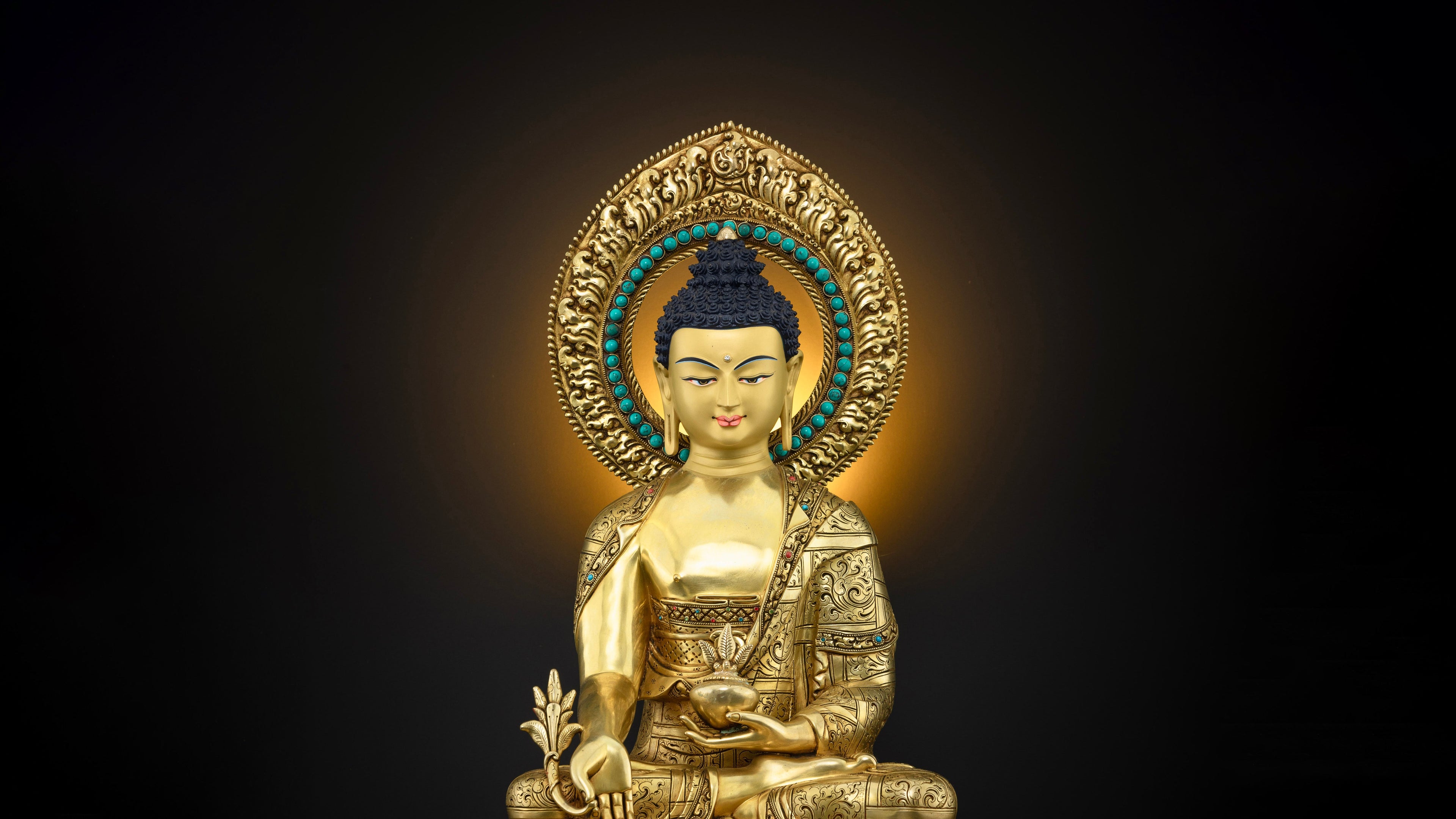 Medicine buddha statue pure gold with a halo and intricately carved details