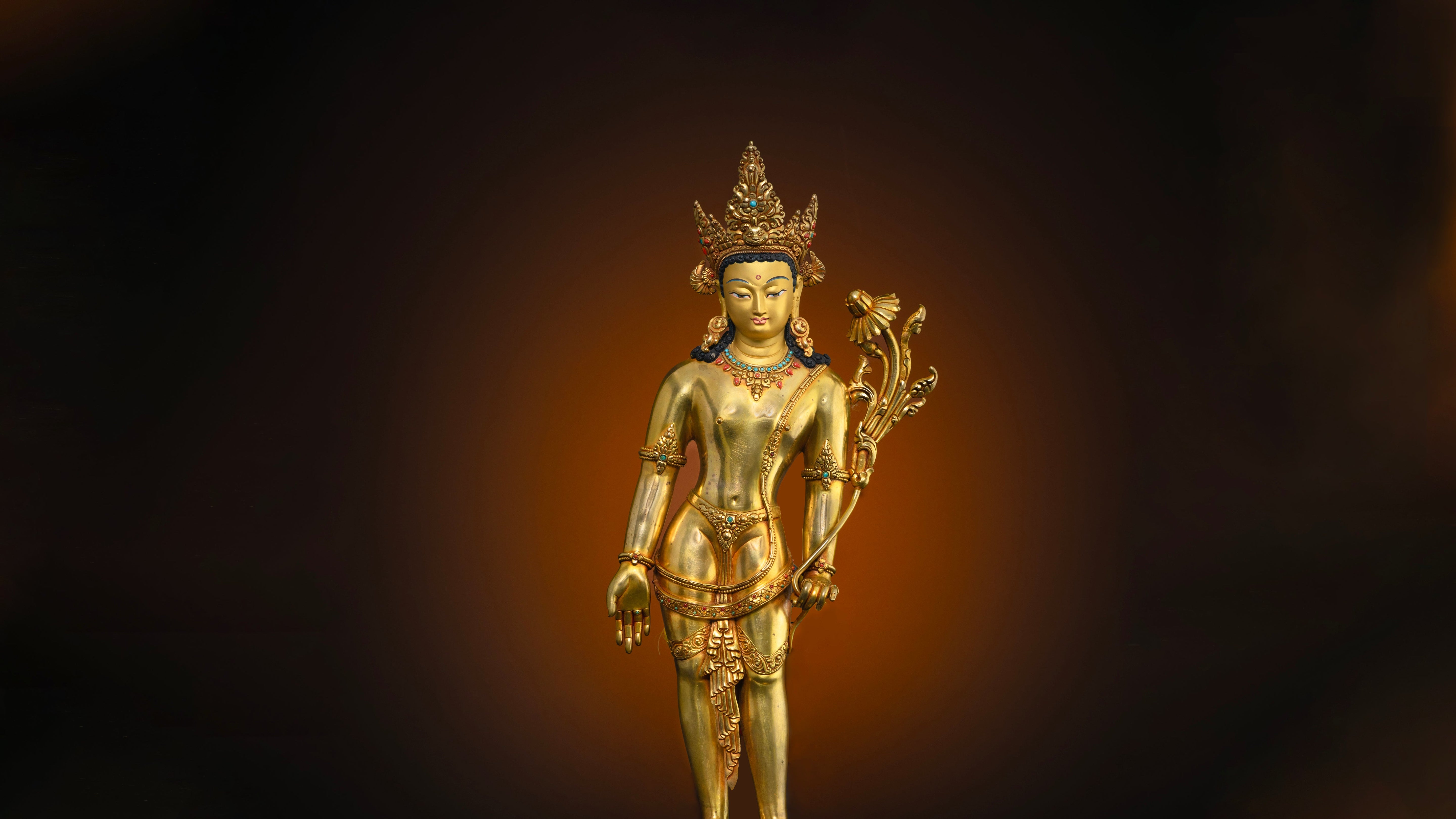 bright golden statue of Bodhisattva Padmapani