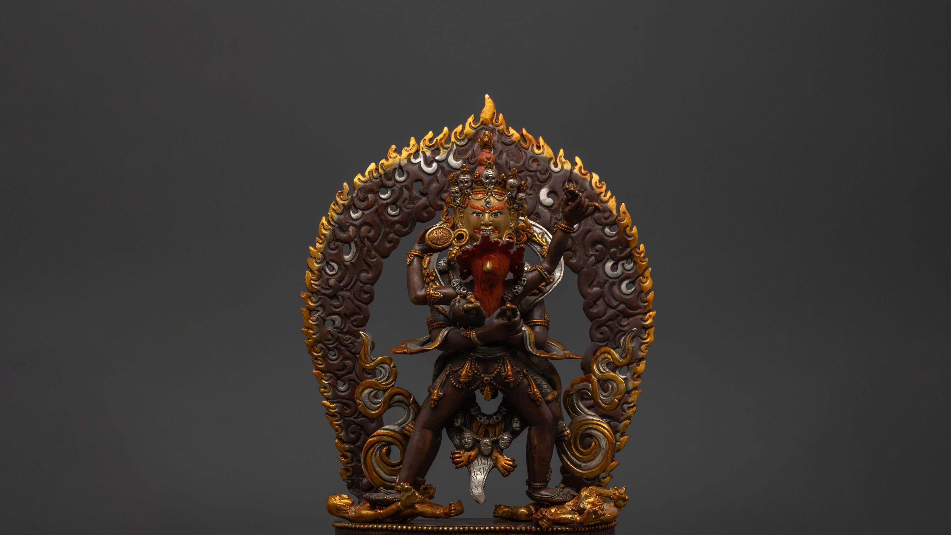 Brown Chakrasamvara statue with gold, silver and red accents 