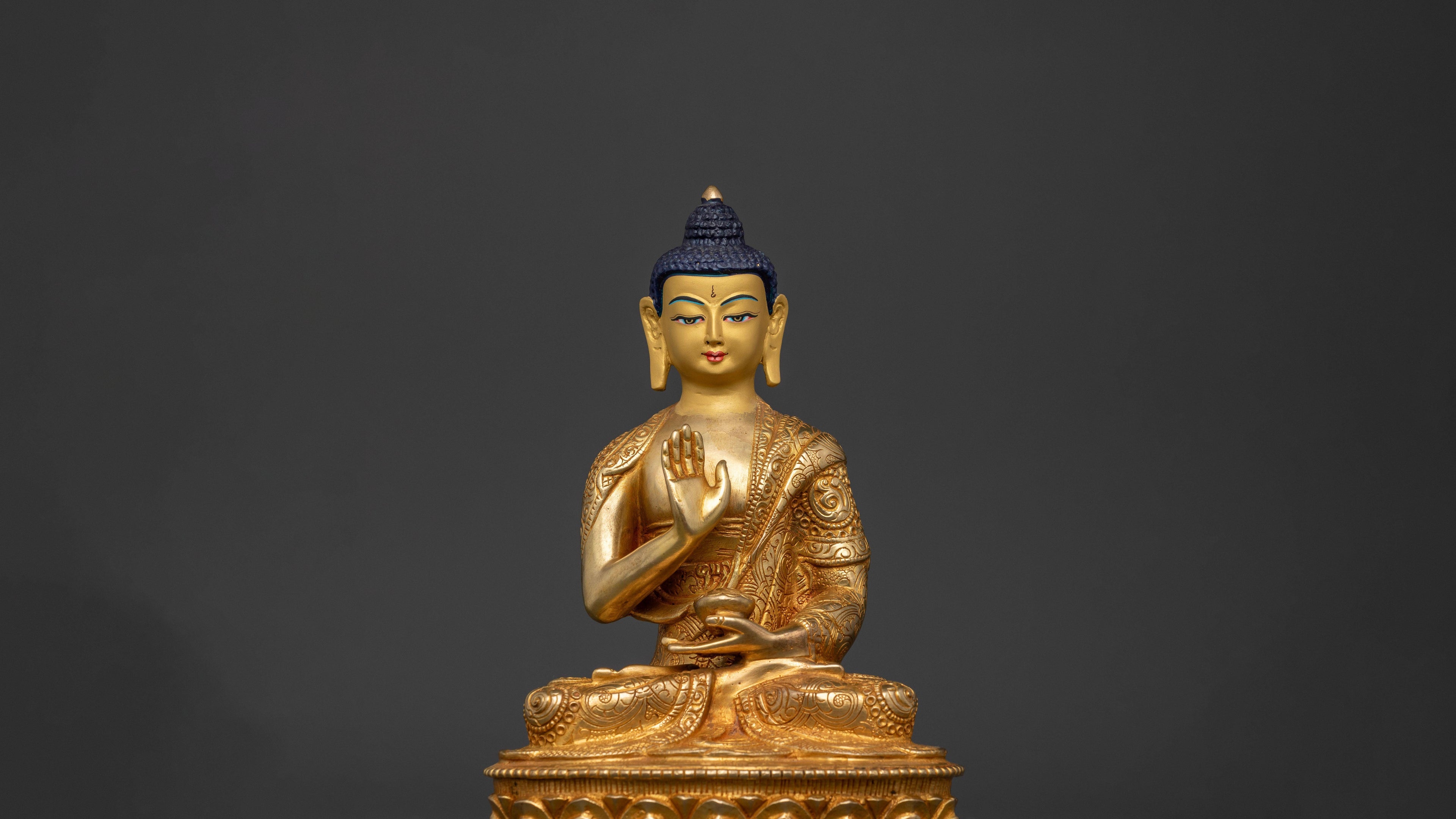 Gold plated on a copper base statue of Amoghasiddhi Buddha with a blessing giving position of his hand