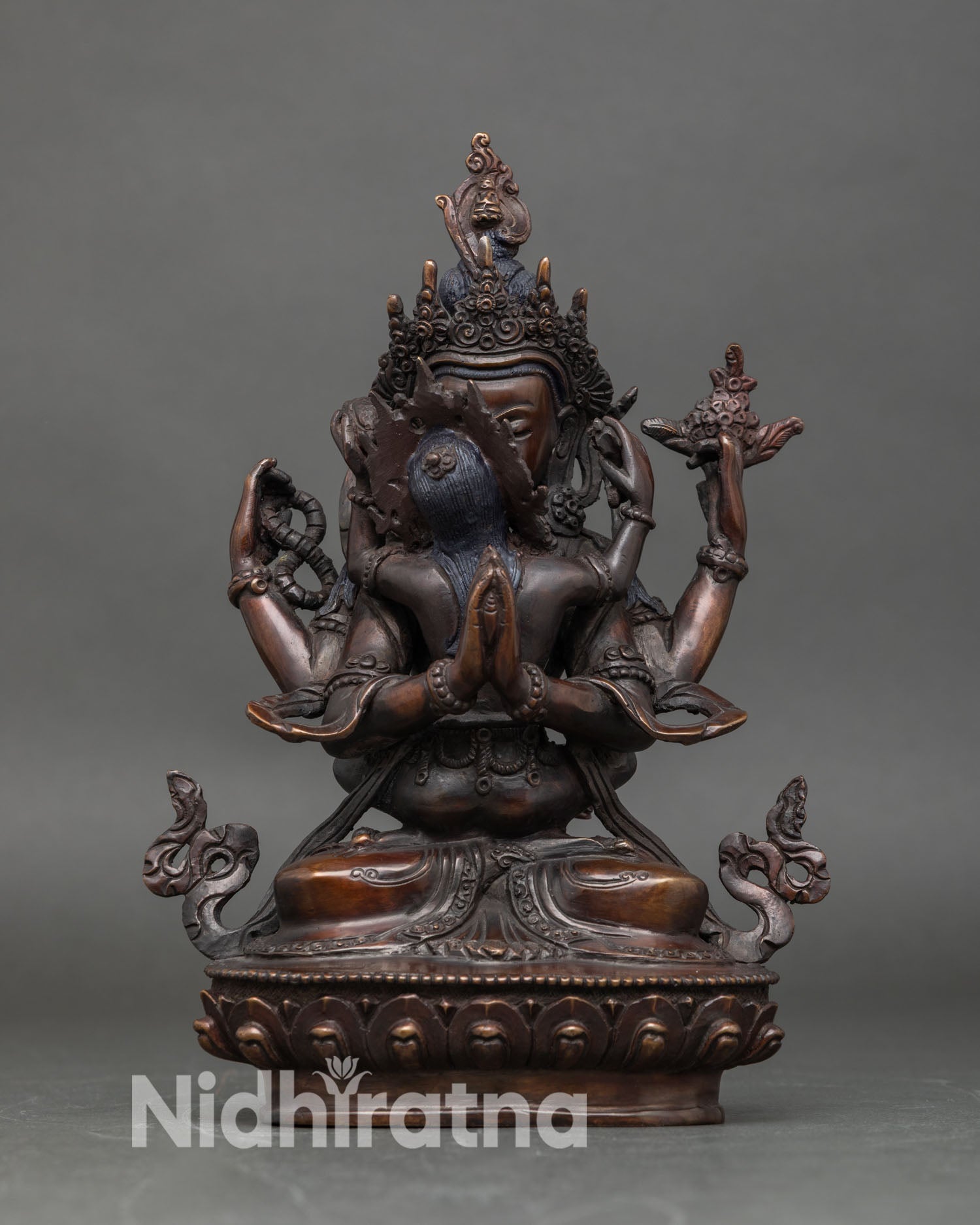 front view of chenrezig consort statue handcrafted copper oxidized finish four hands rosary blue lotus cintamani