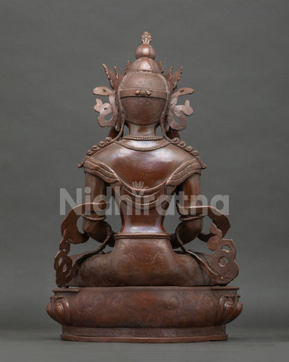 Back view Amitayus statue showing detailed robes jewelry and hand carved lotus pedestal.