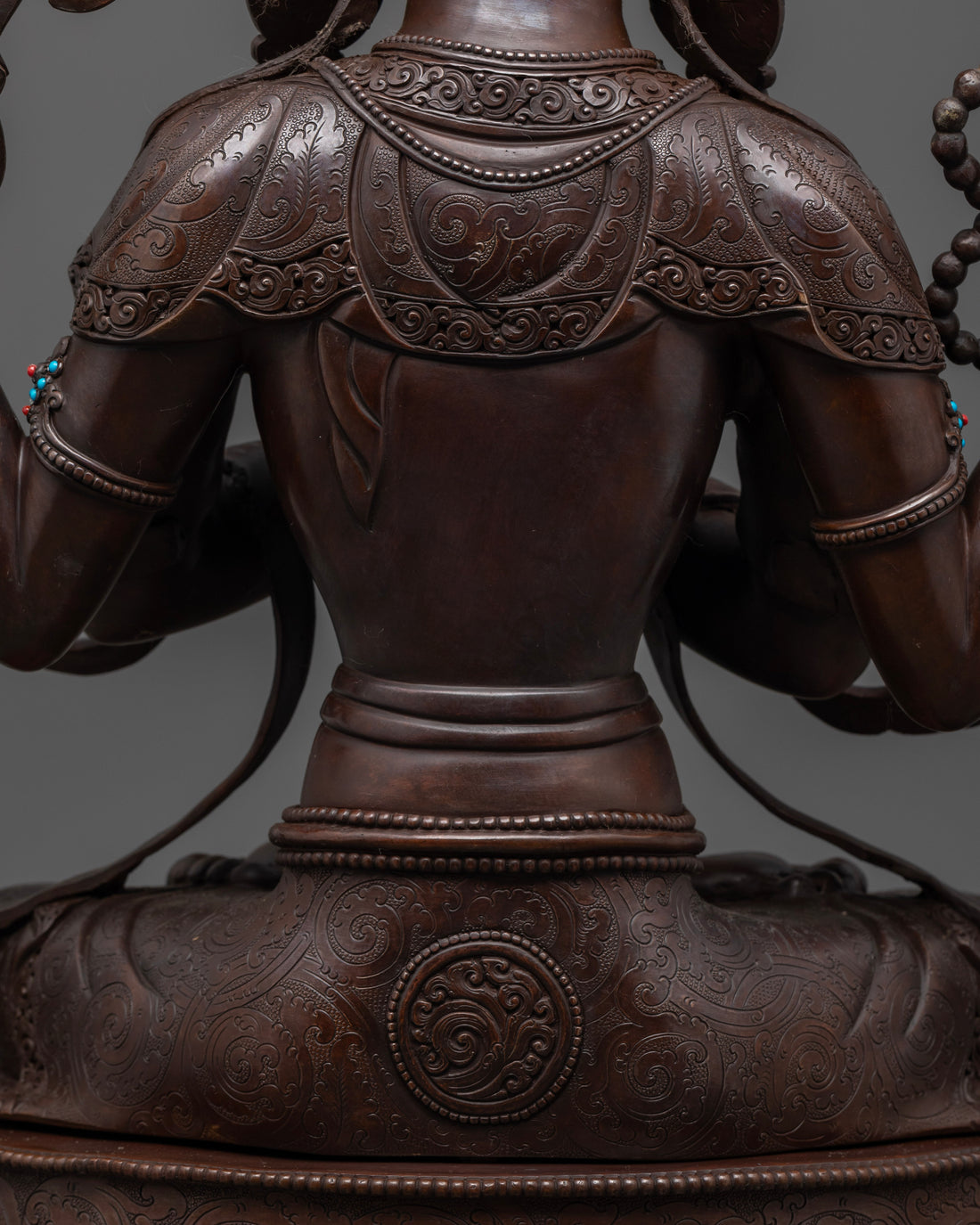 back view of oxidized chenrezig statue