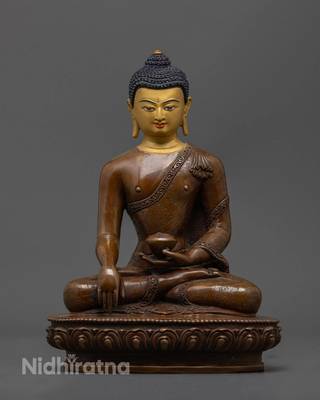24K gold-faced Shakyamuni Buddha statue seated in meditation on oxidized copper lotus throne, handcrafted in Nepal with mantra chamber