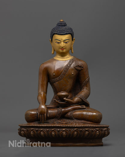 24K gold-faced Shakyamuni Buddha statue seated in meditation on oxidized copper lotus throne, handcrafted in Nepal with mantra chamber