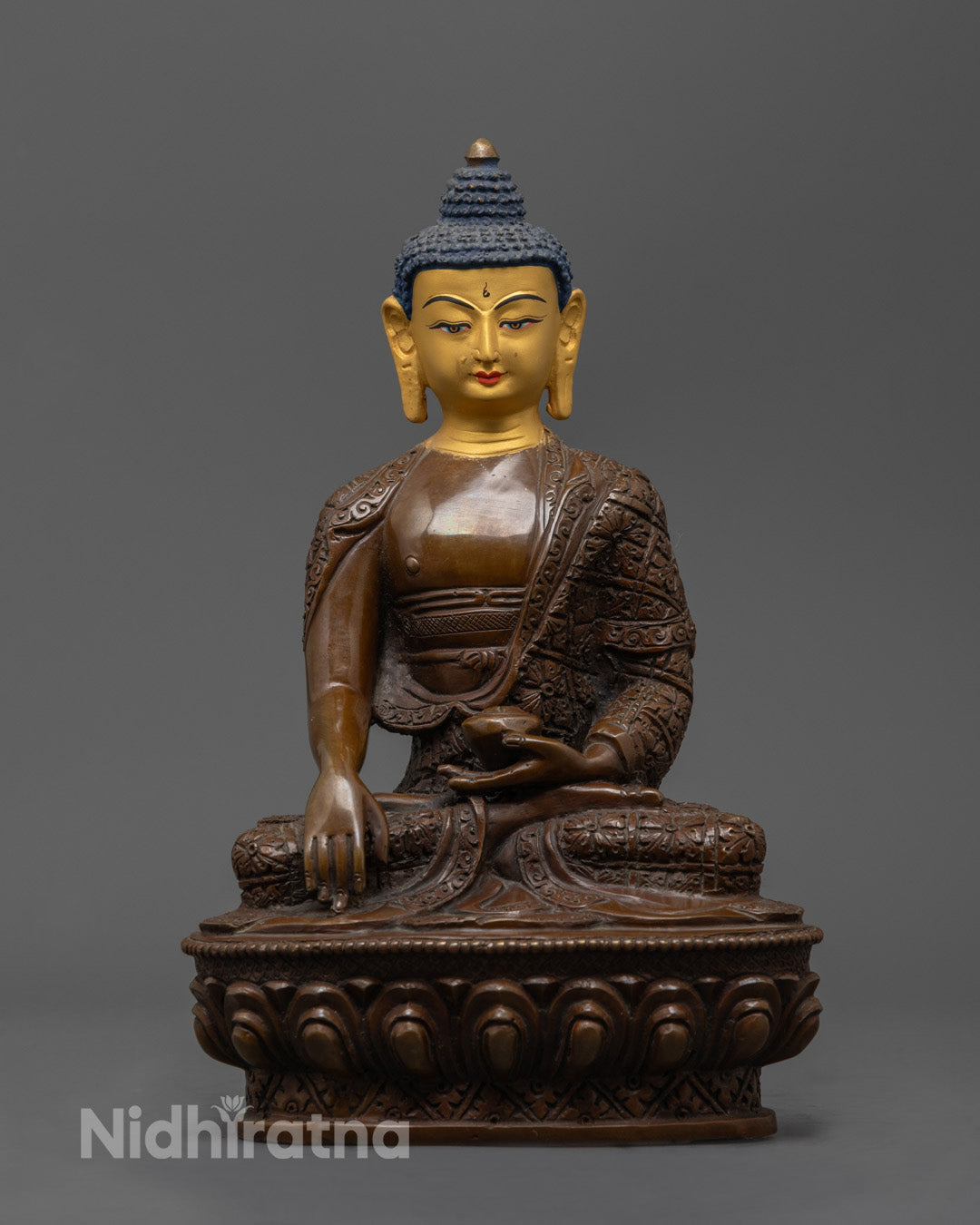24K gold-faced Shakyamuni Buddha statue in Bhumisparsha mudra, seated on oxidized copper lotus throne with hollow mantra chamber