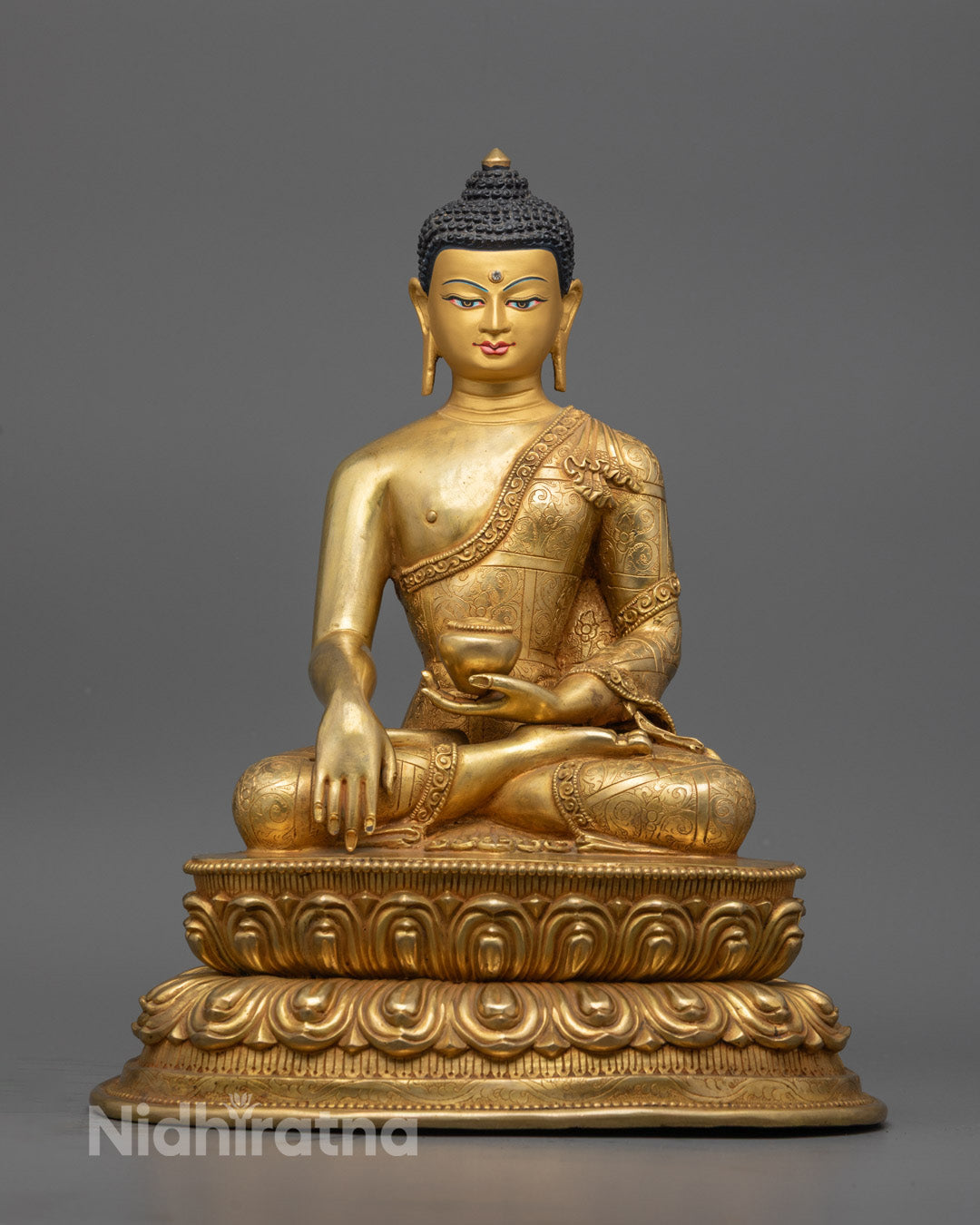 24K gold-gilded Shakyamuni Buddha statue in meditation pose, seated on lotus throne with semi-precious stone accents, hand-carved in Nepal