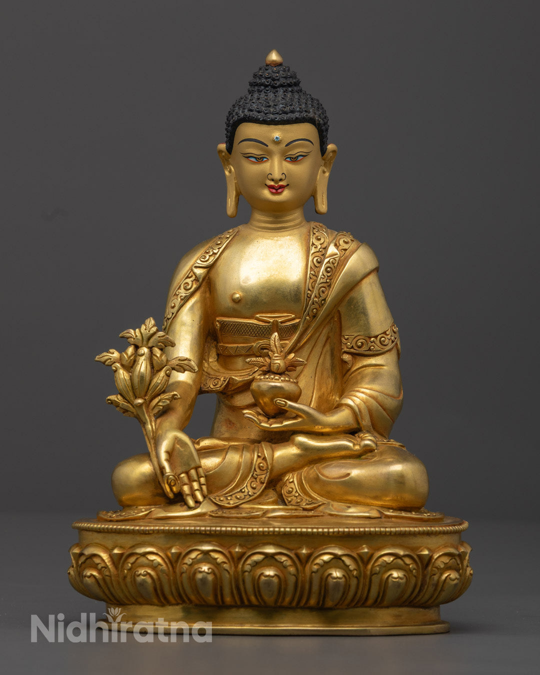 24K gold gilded Medicine Buddha statue seated on a lotus throne, handcrafted in copper with intricate Nepalese detailing for spiritual healing and meditation.