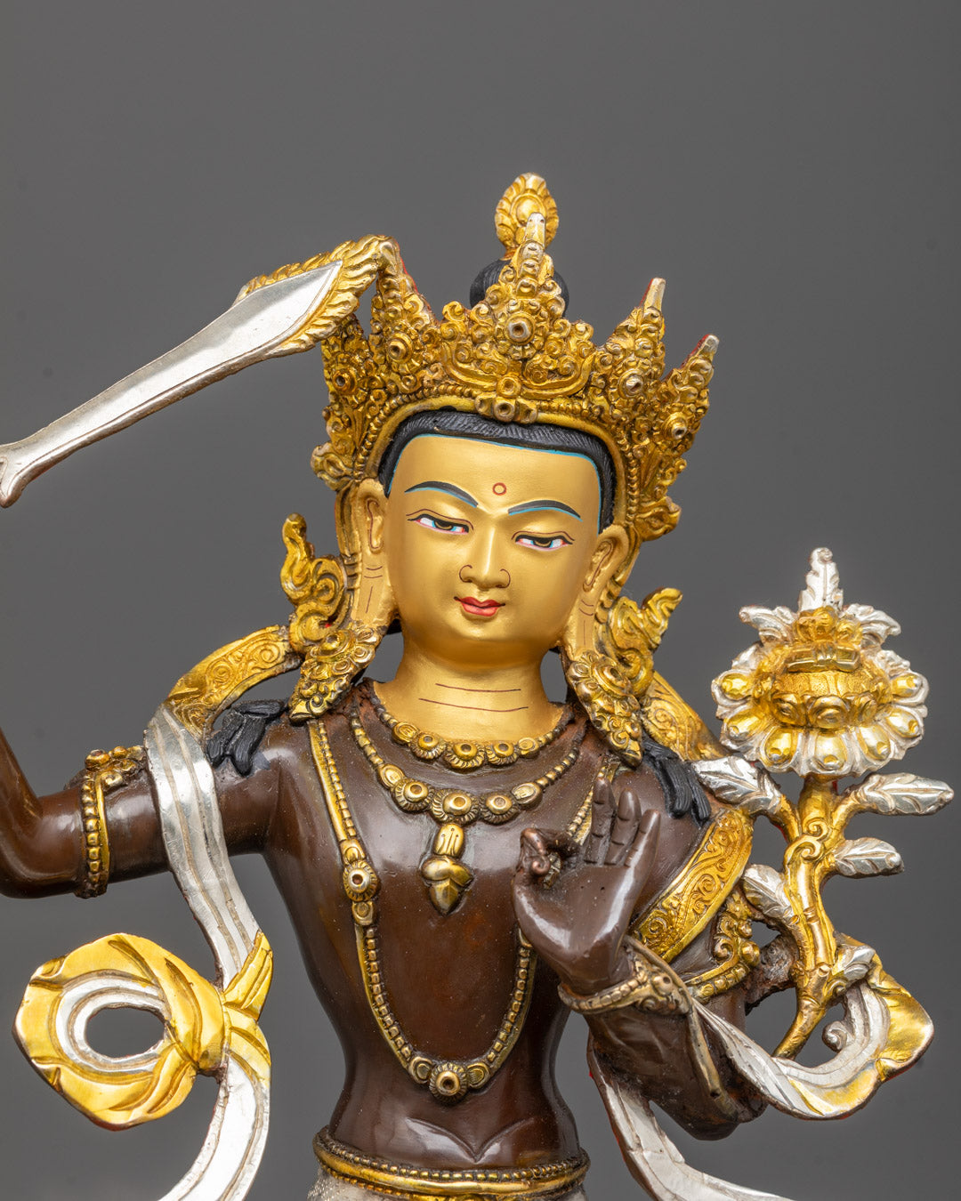 24k gold gilded Manjushri statue holding Prajnaparamita Sutra on lotus
