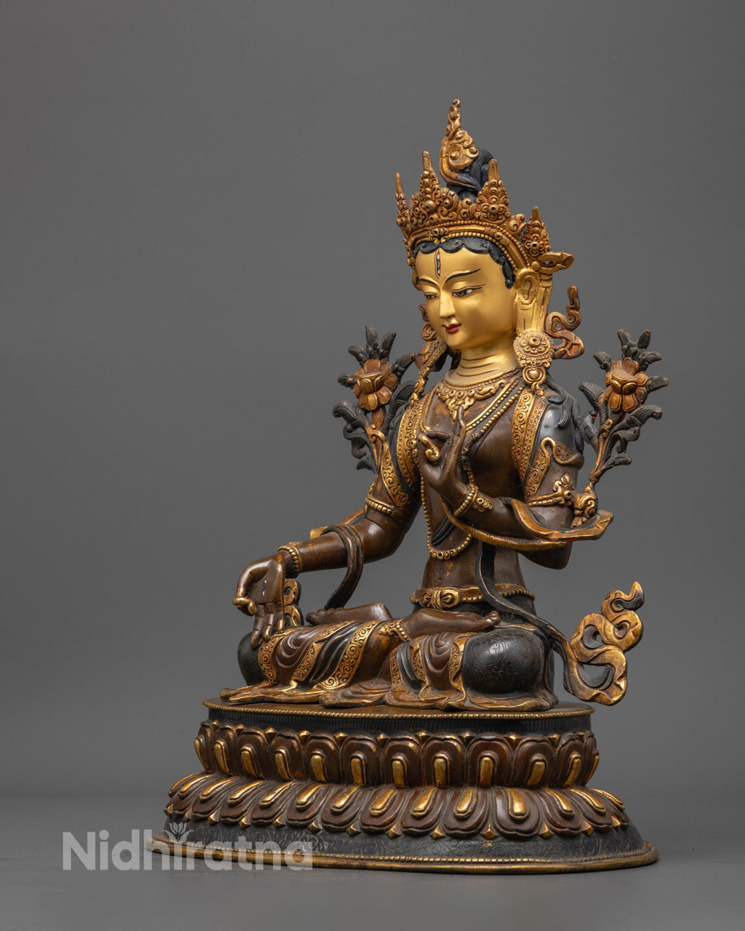 37cm Handmade Oxidized White Tara Statue holding pundarika lotus, seated on ornate lotus throne with vibrant acrylic detailing.