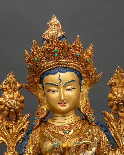 Regular close-up of White Tara sculpture showing intricate lotus seat and gold details