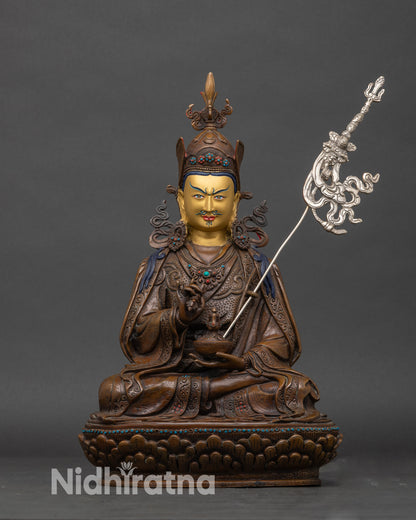 A handcrafted Tsokye Dorje statue from Nepal made of copper, seated on a lotus throne with intricate details.