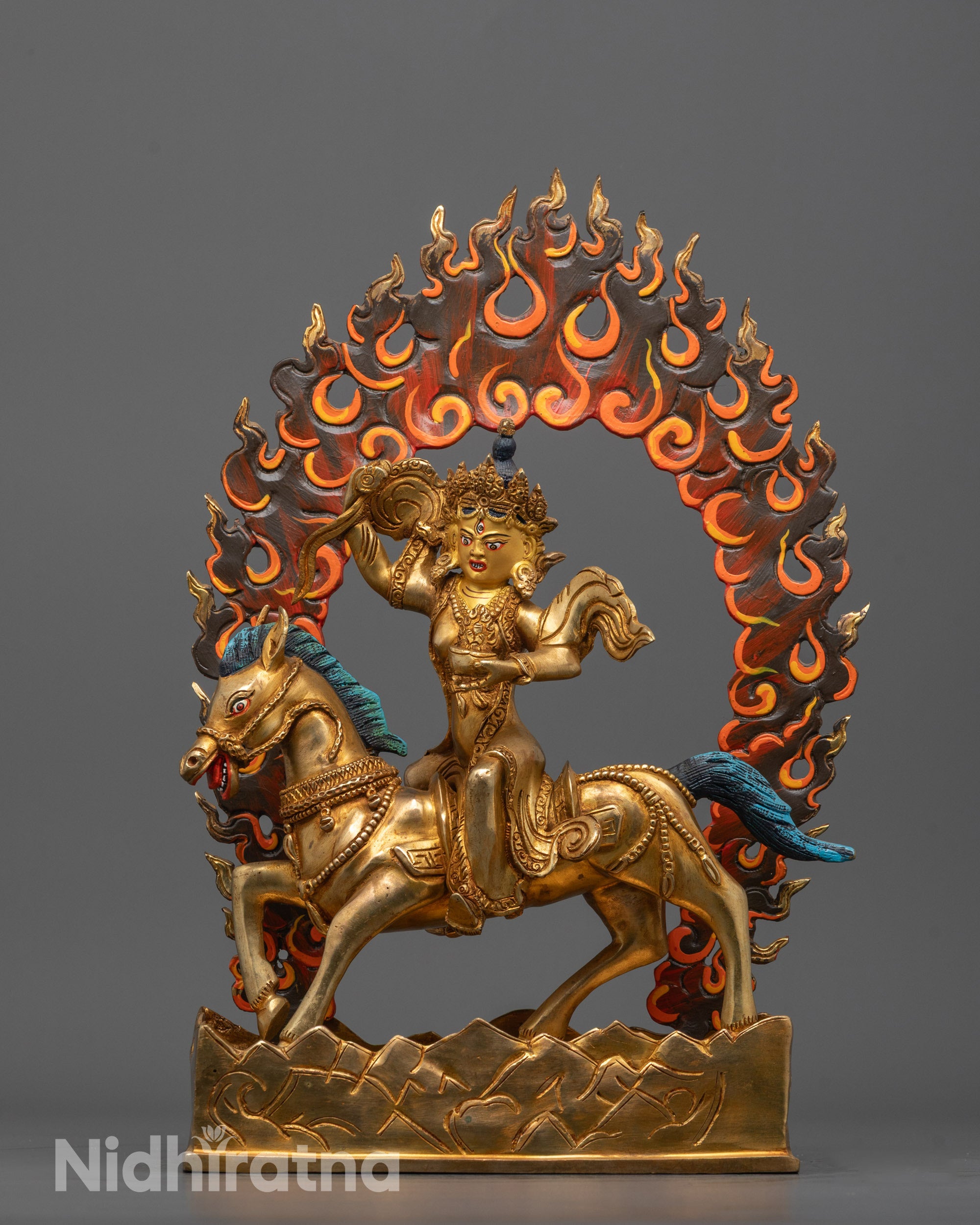 Front view of Achi Chokyi Drolma statue with gold-gilded face and radiant halo