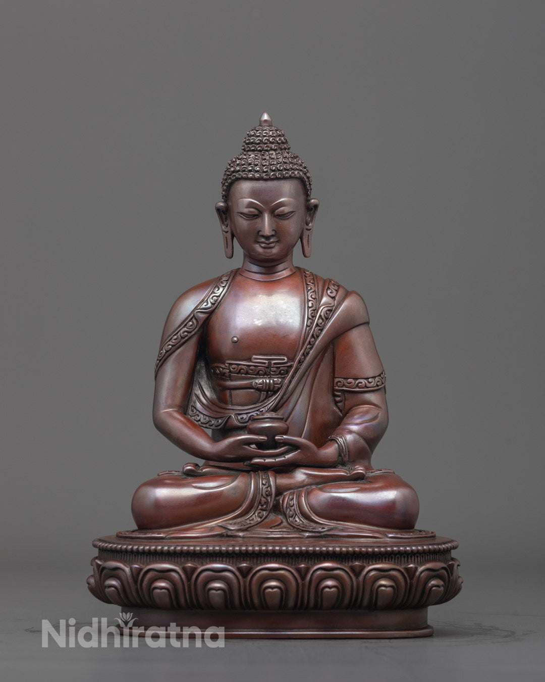 Amida Buddha statue front - oxidized copper, lotus throne, holding Patra bowl.