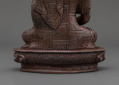 back view of oxidized three buddha set highlighting detailed copper craftsmanship and patterns
