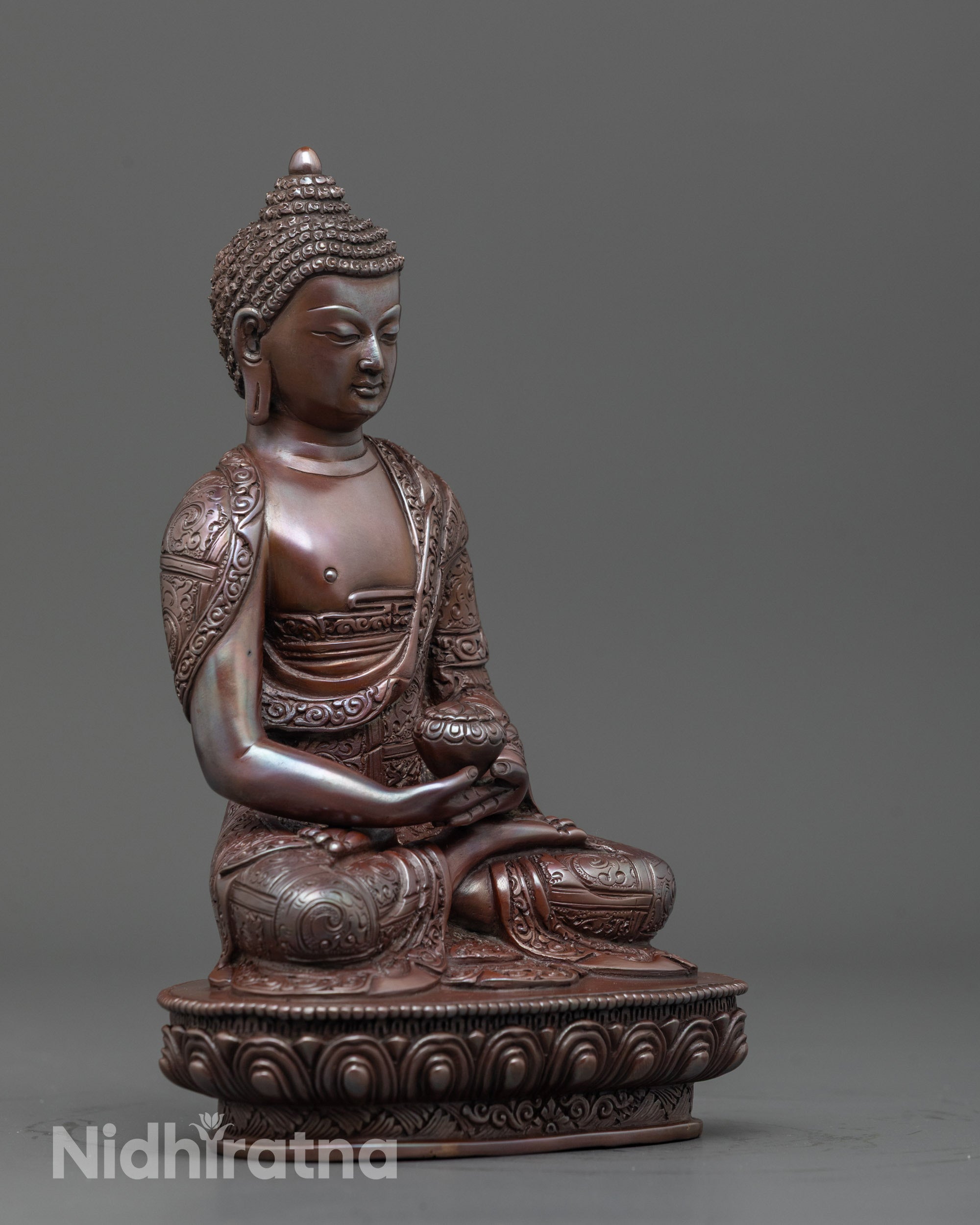 Side angle of Oxidized Amitabha Buddha wearing monk’s robe in dhyana mudra pose