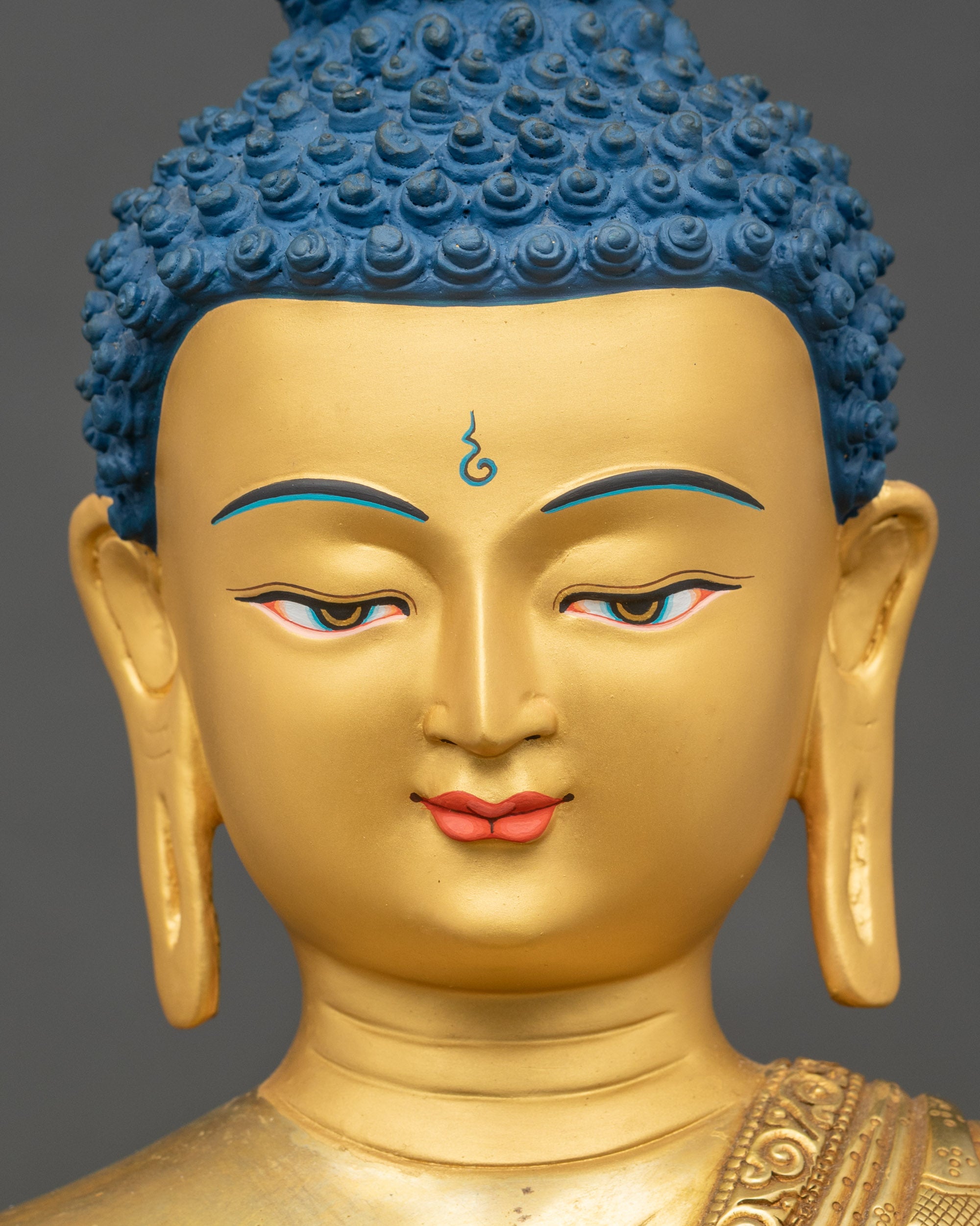 Detailed close-up of Amitabha Buddha face, gold-painted, serene Himalayan expression