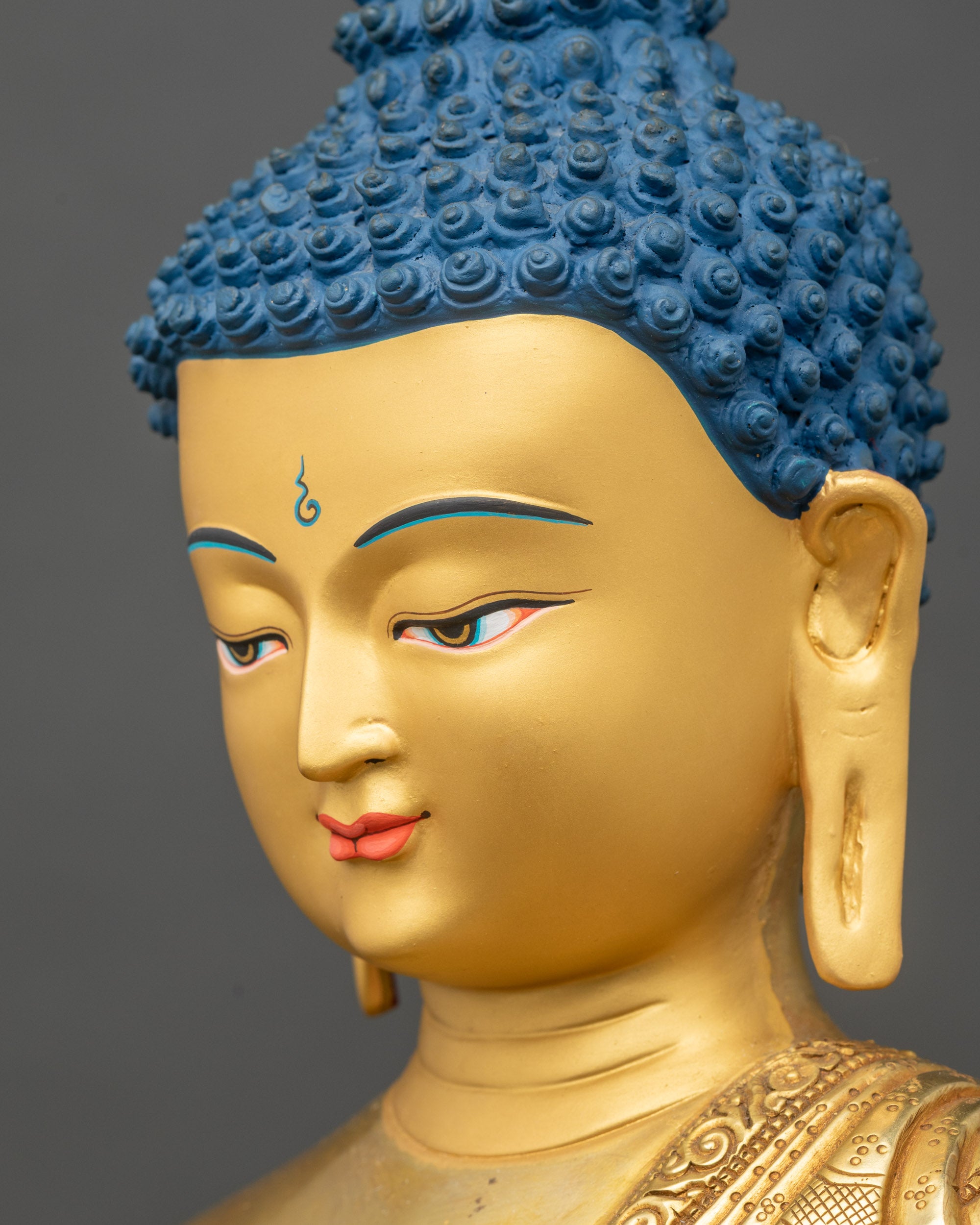 Detailed side close-up of Amitabha Buddha face, golden finish, handcrafted Nepalese art