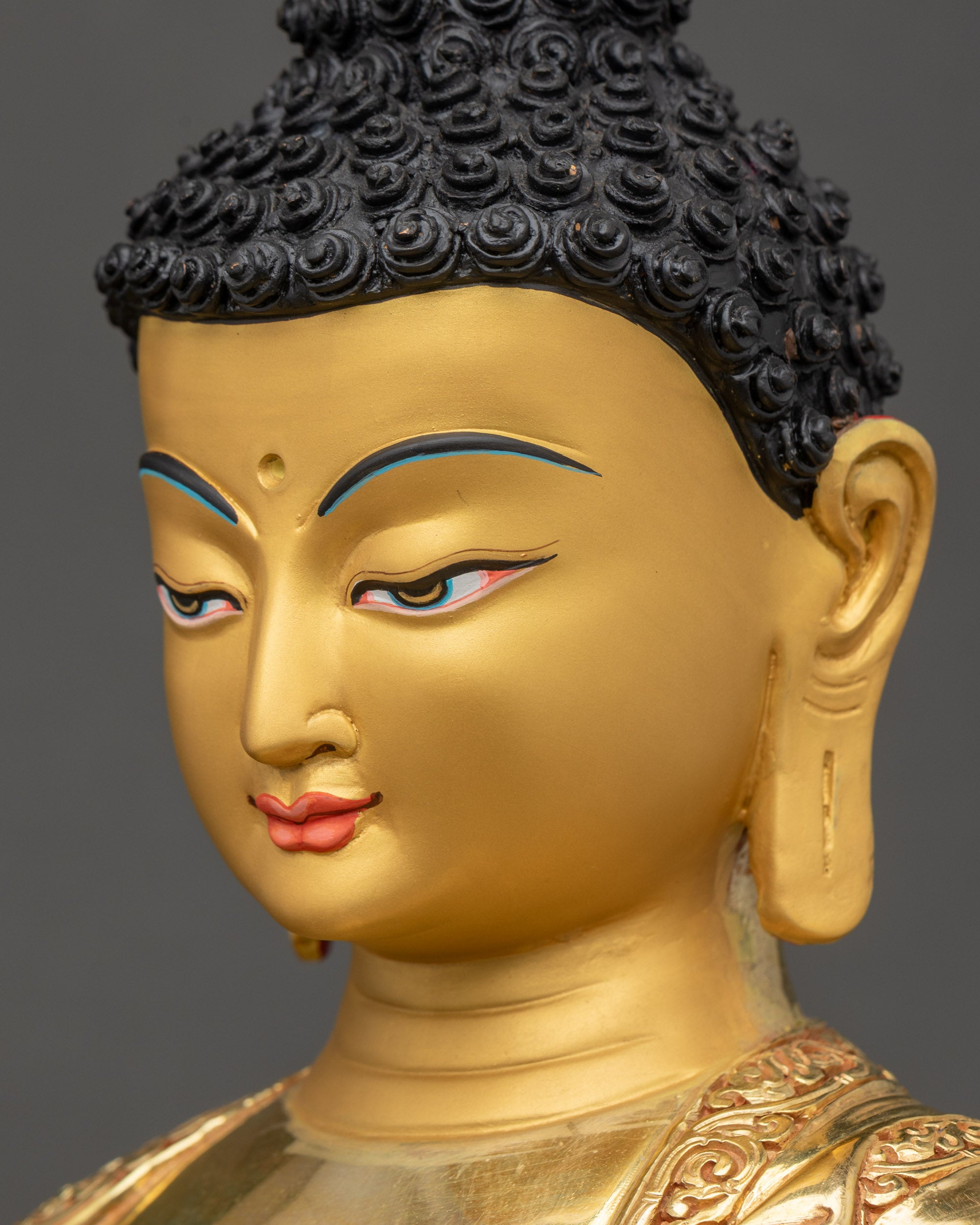 Amitabha Buddha face side close up with gold fire-gilding details