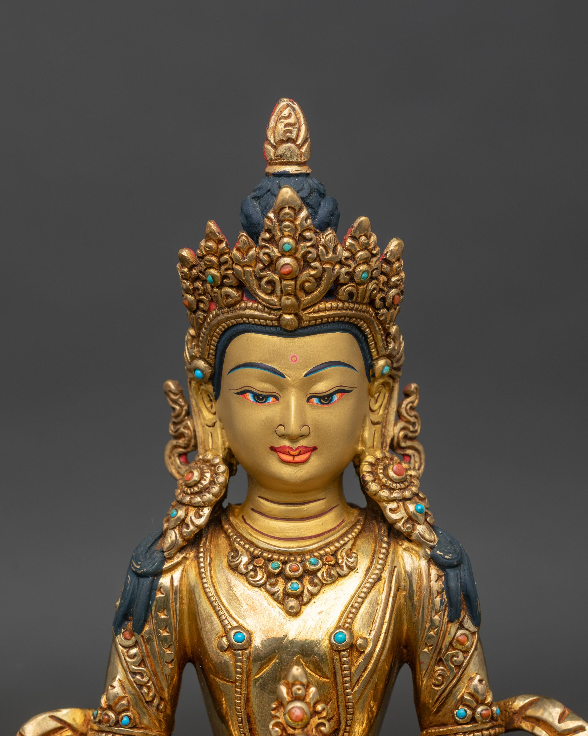 Amitayus statue close up gold painted face 24k gilded copper Himalayan Buddhist art