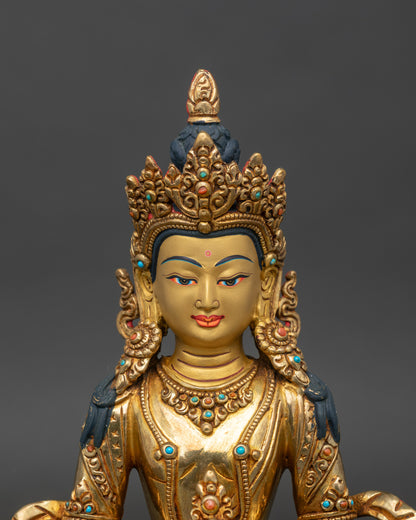 Amitayus statue close up gold painted face 24k gilded copper Himalayan Buddhist art