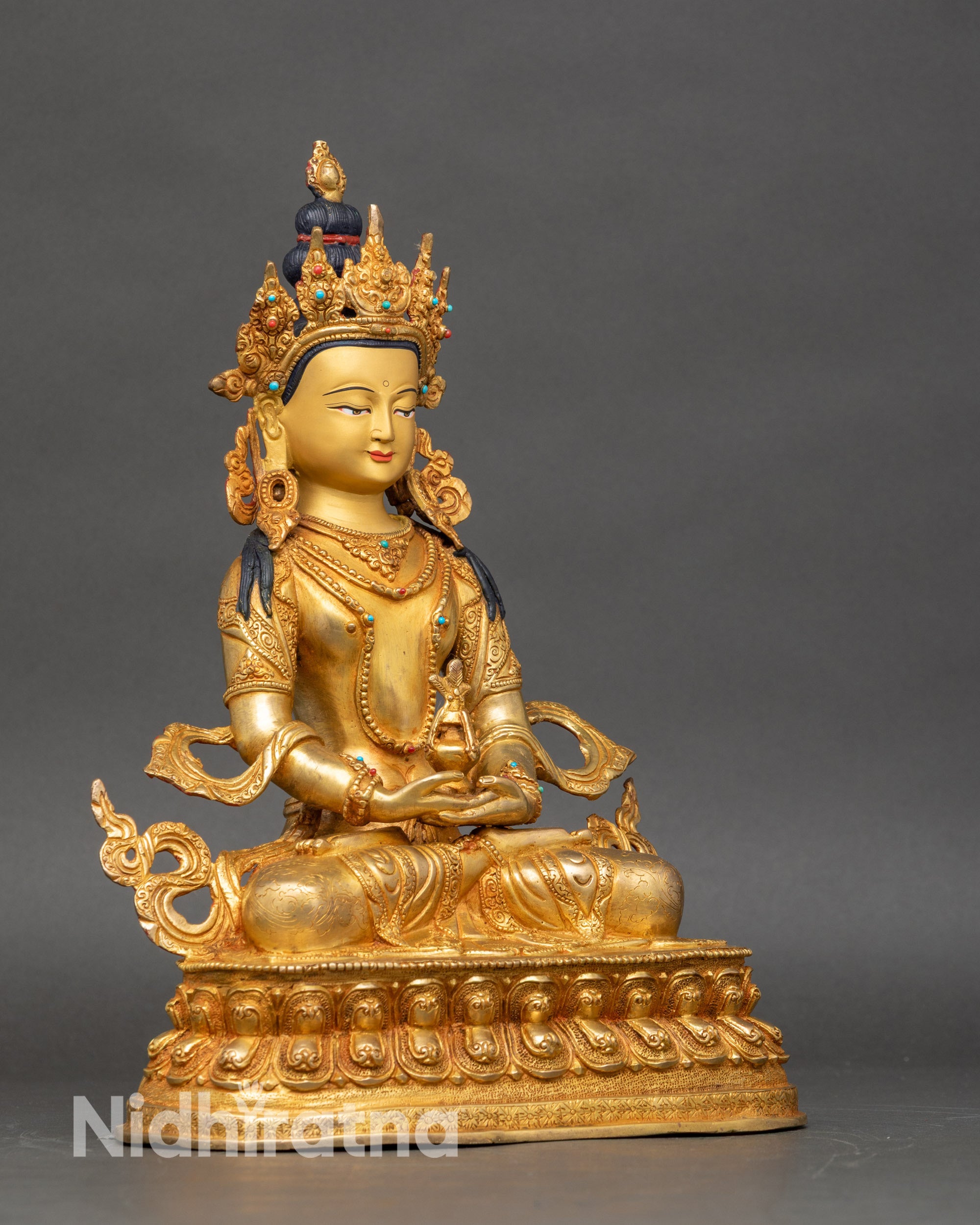 Amitayus statue right side view, hand-gilded copper with ornate Himalayan design